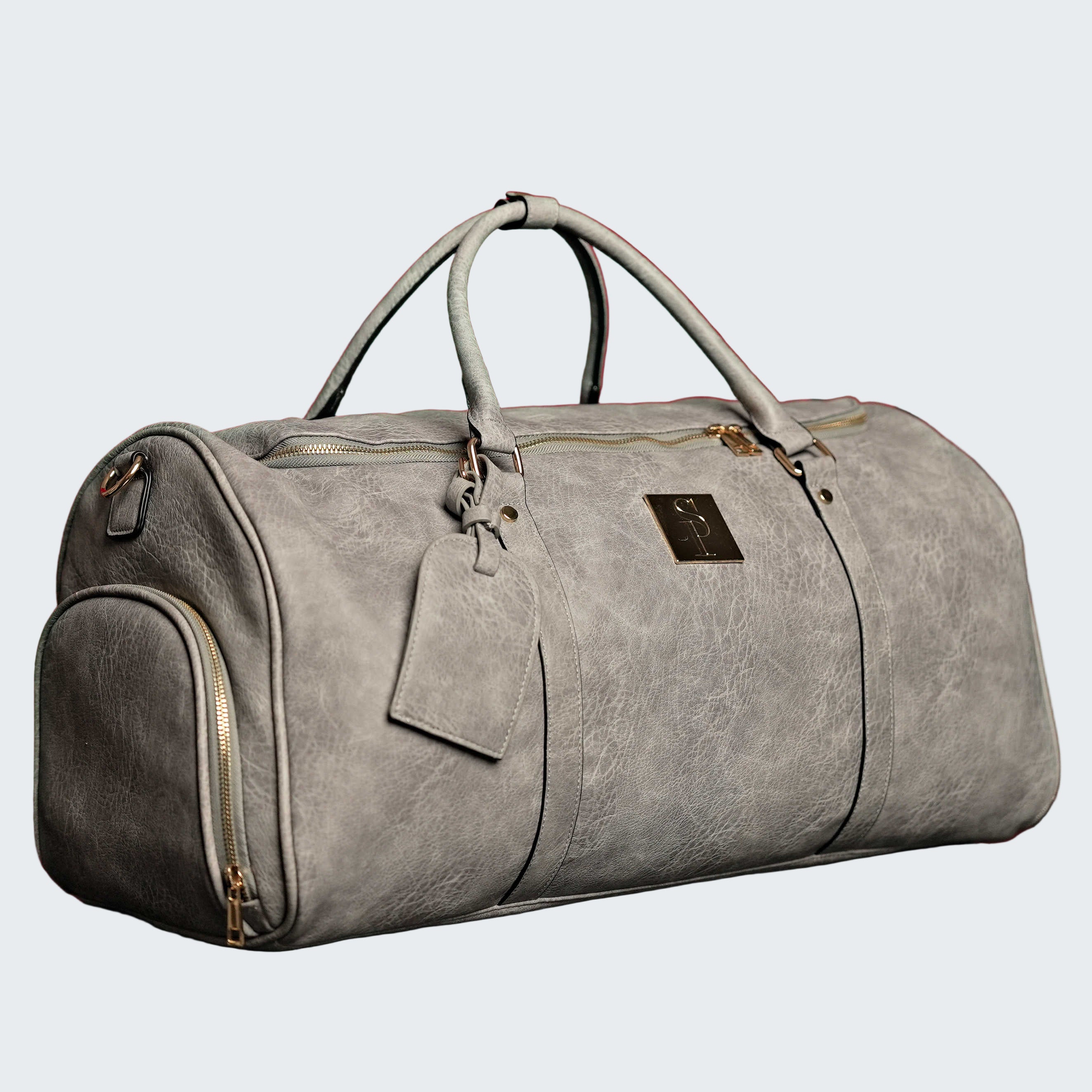 Gray duffel bag with a tag on a red background