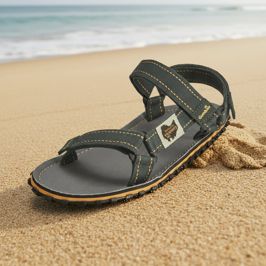 Black sandal with a strap on a white background