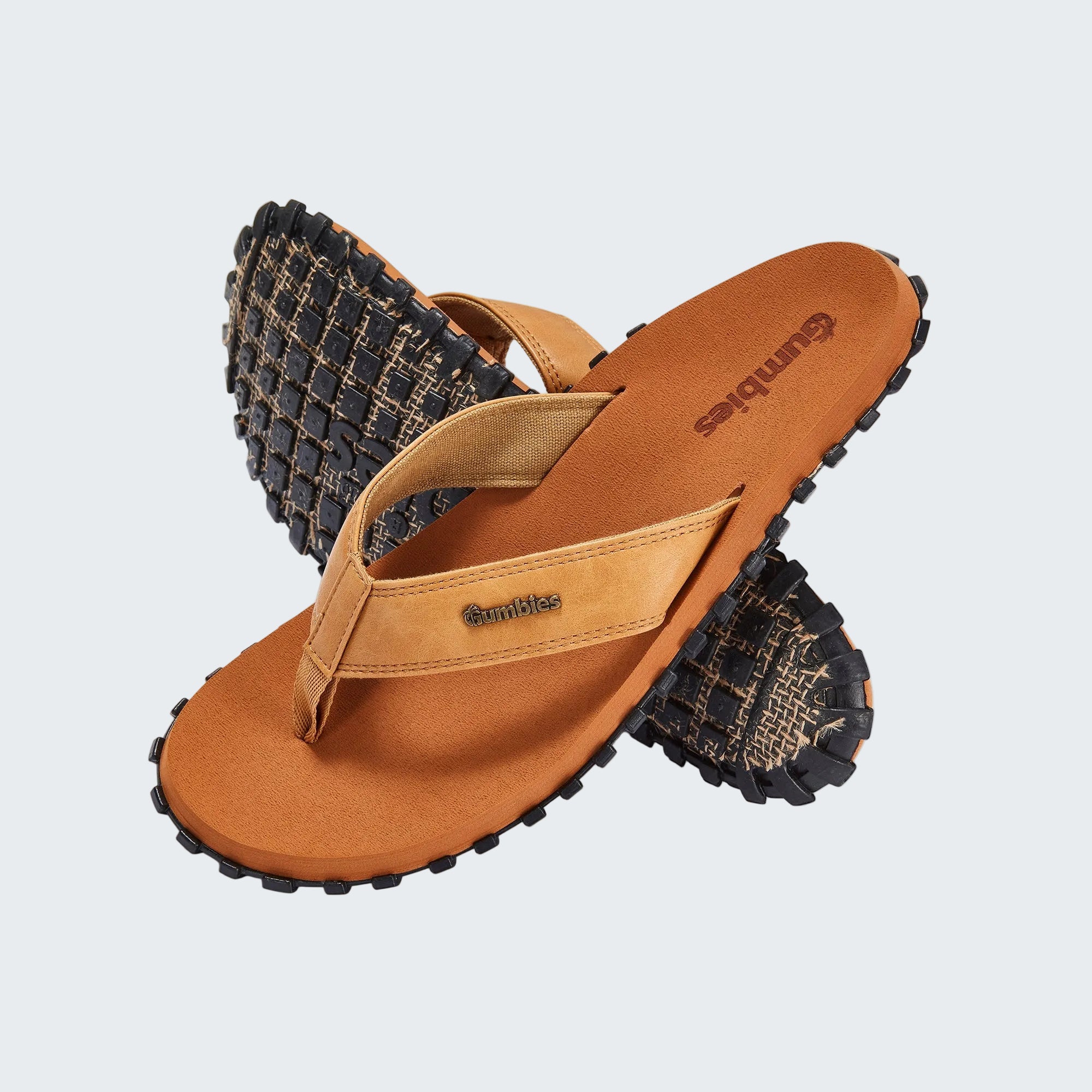 Brown sandal with textured sole on a white background