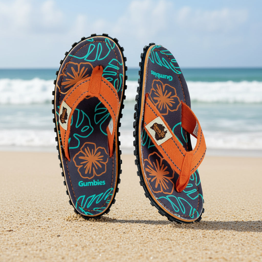 Pair of flip-flops with floral design on a white background