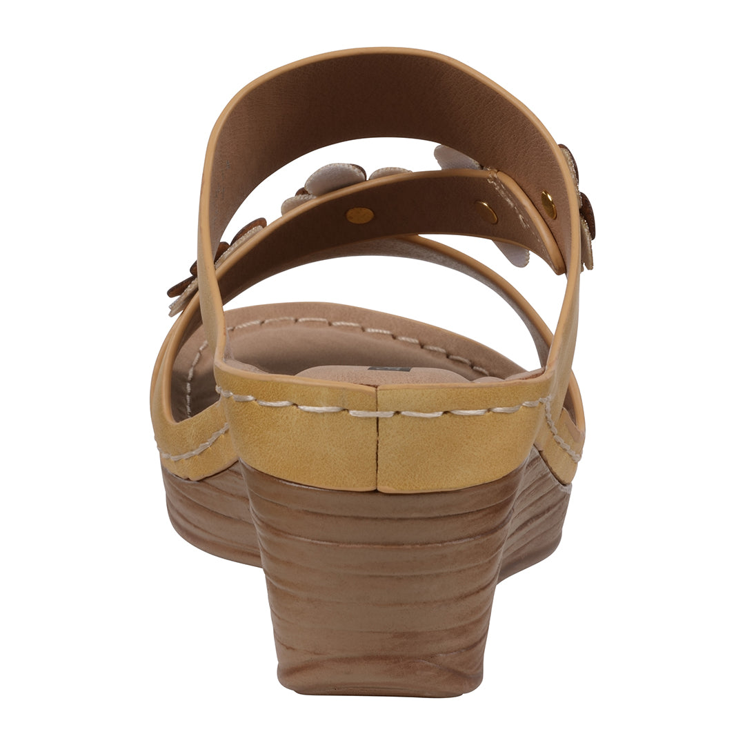 Brown sandal with a white sole on a white background