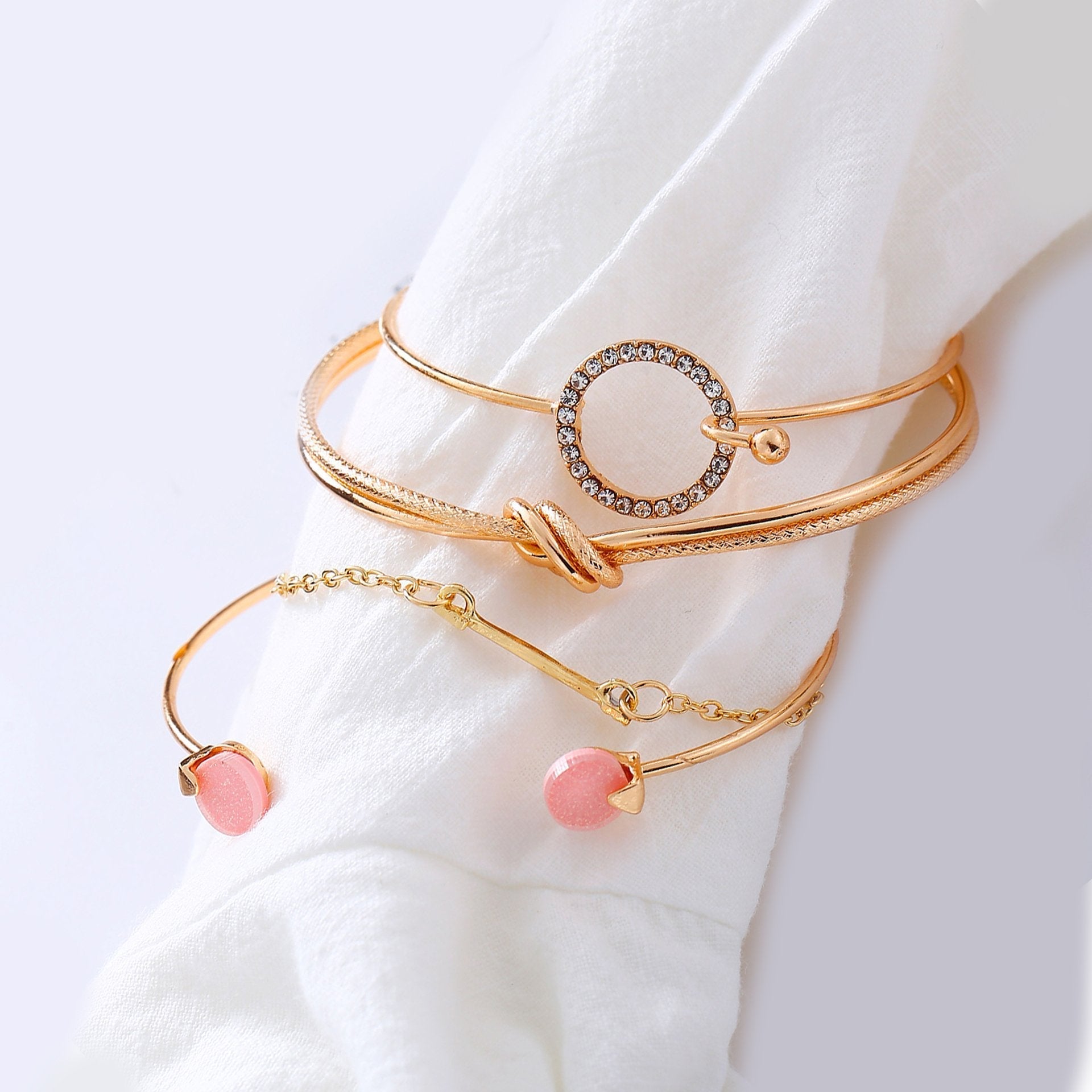 Four Piece Pink Bracelet Set