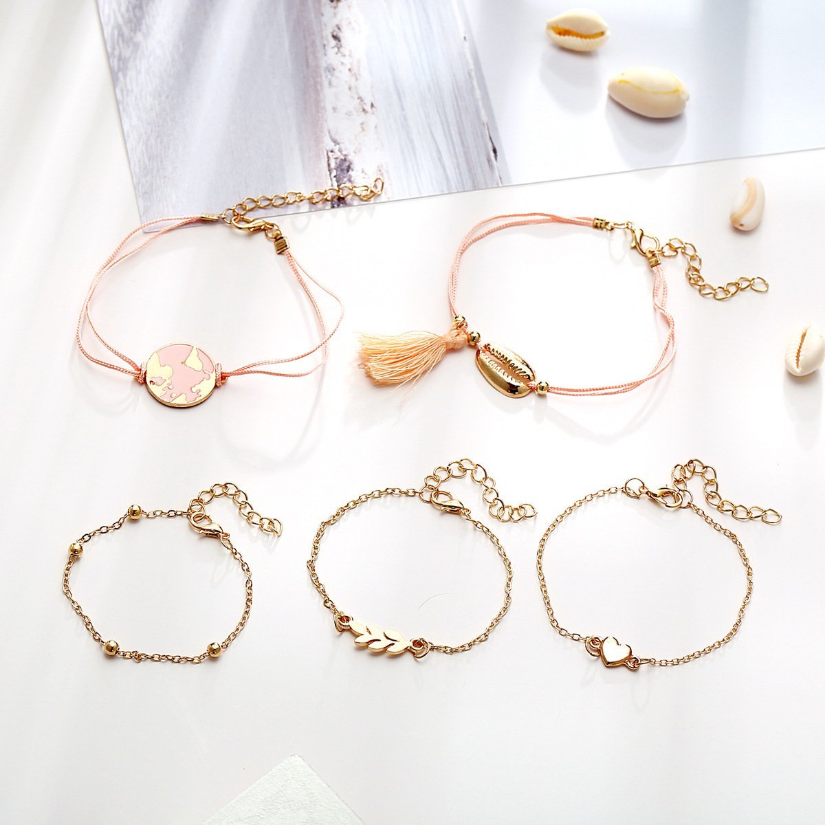 Five Piece Pink Global Tassel Bracelet Set