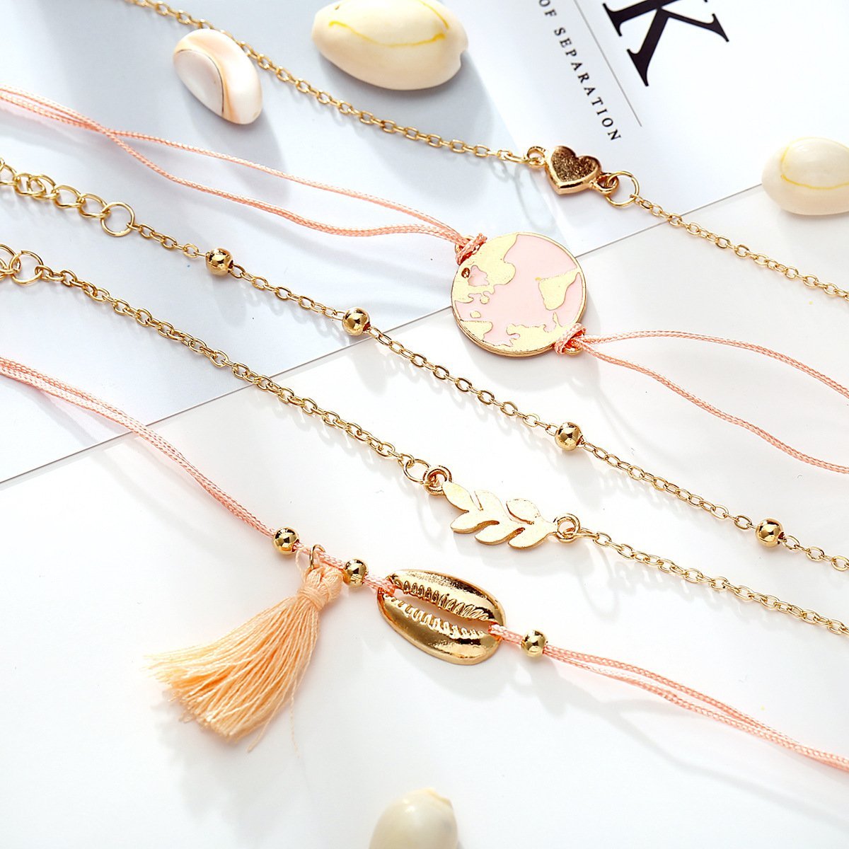 Five Piece Pink Global Tassel Bracelet Set