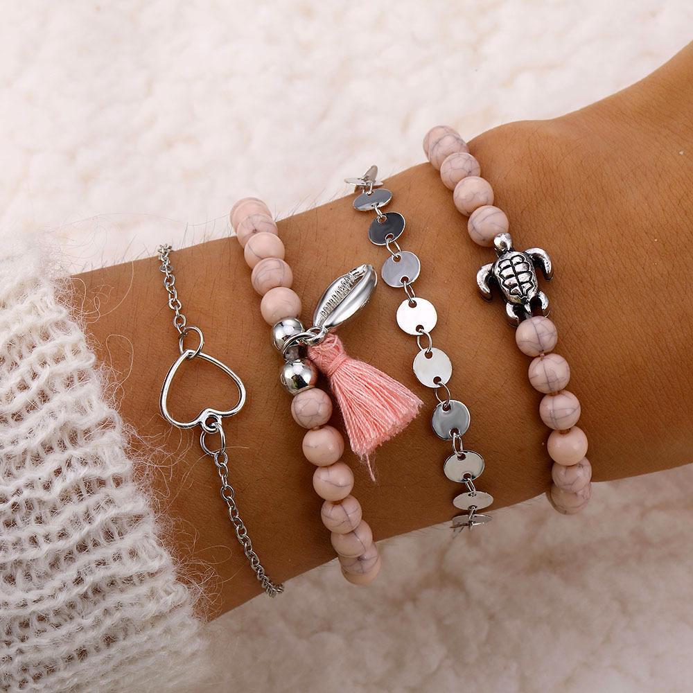 Four Piece Pink Tassel Bracelet Set 