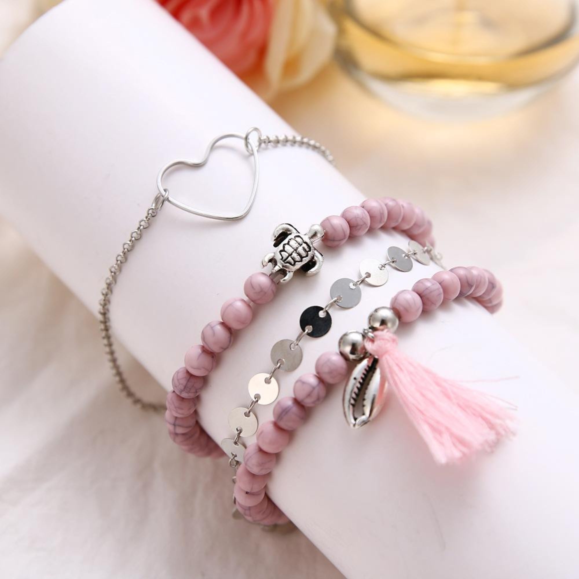 Four Piece Pink Tassel Bracelet Set