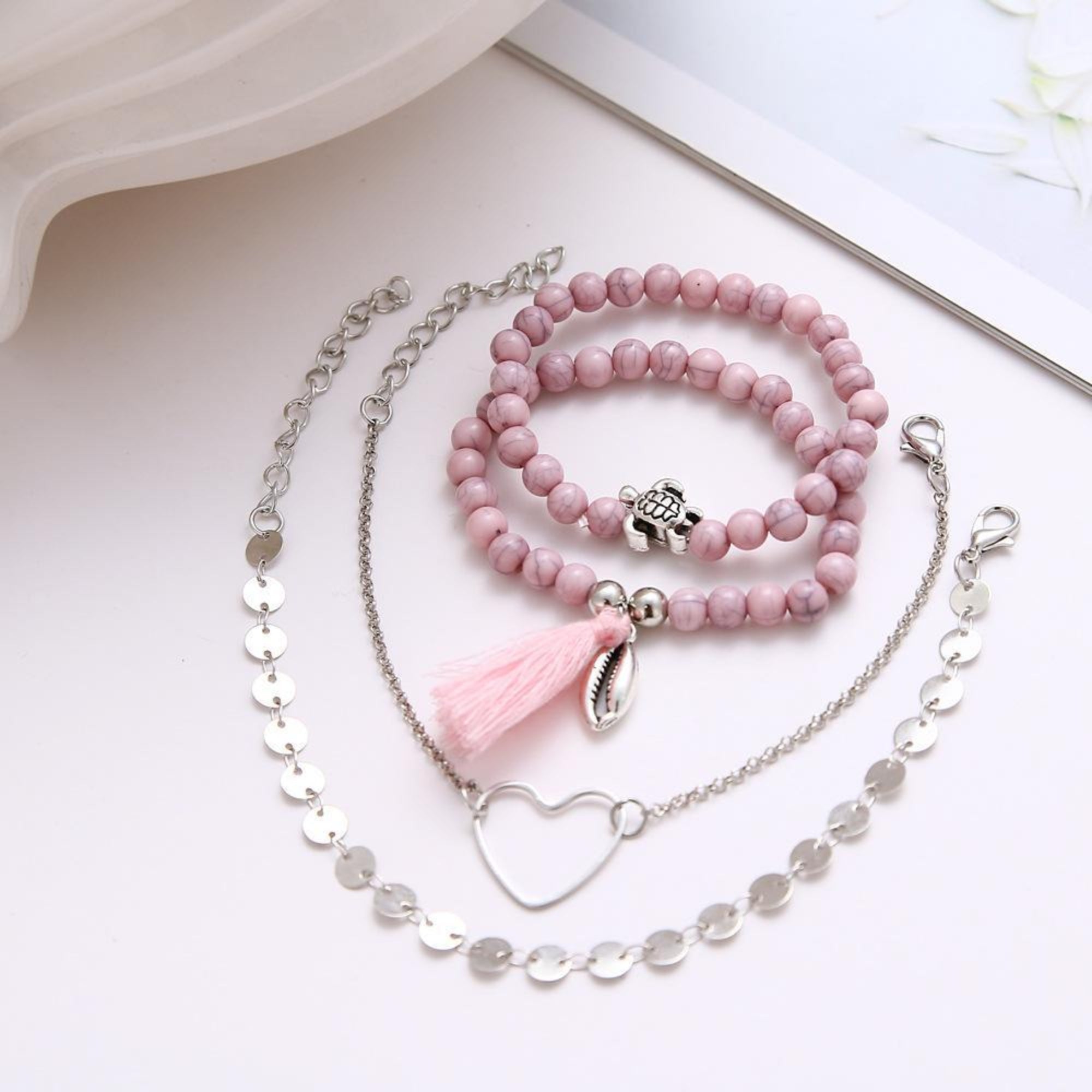 Four Piece Pink Tassel Bracelet Set
