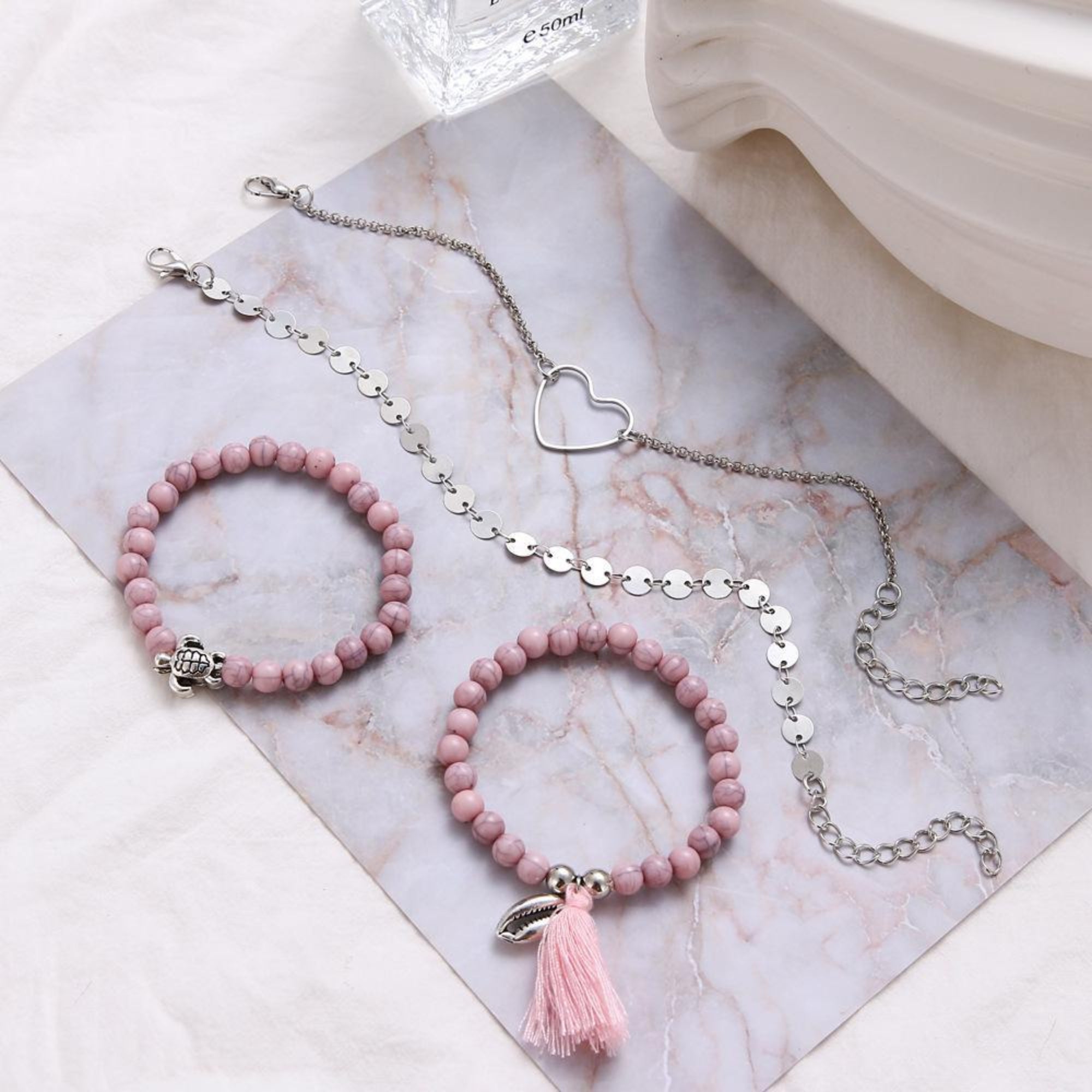Four Piece Pink Tassel Bracelet Set 