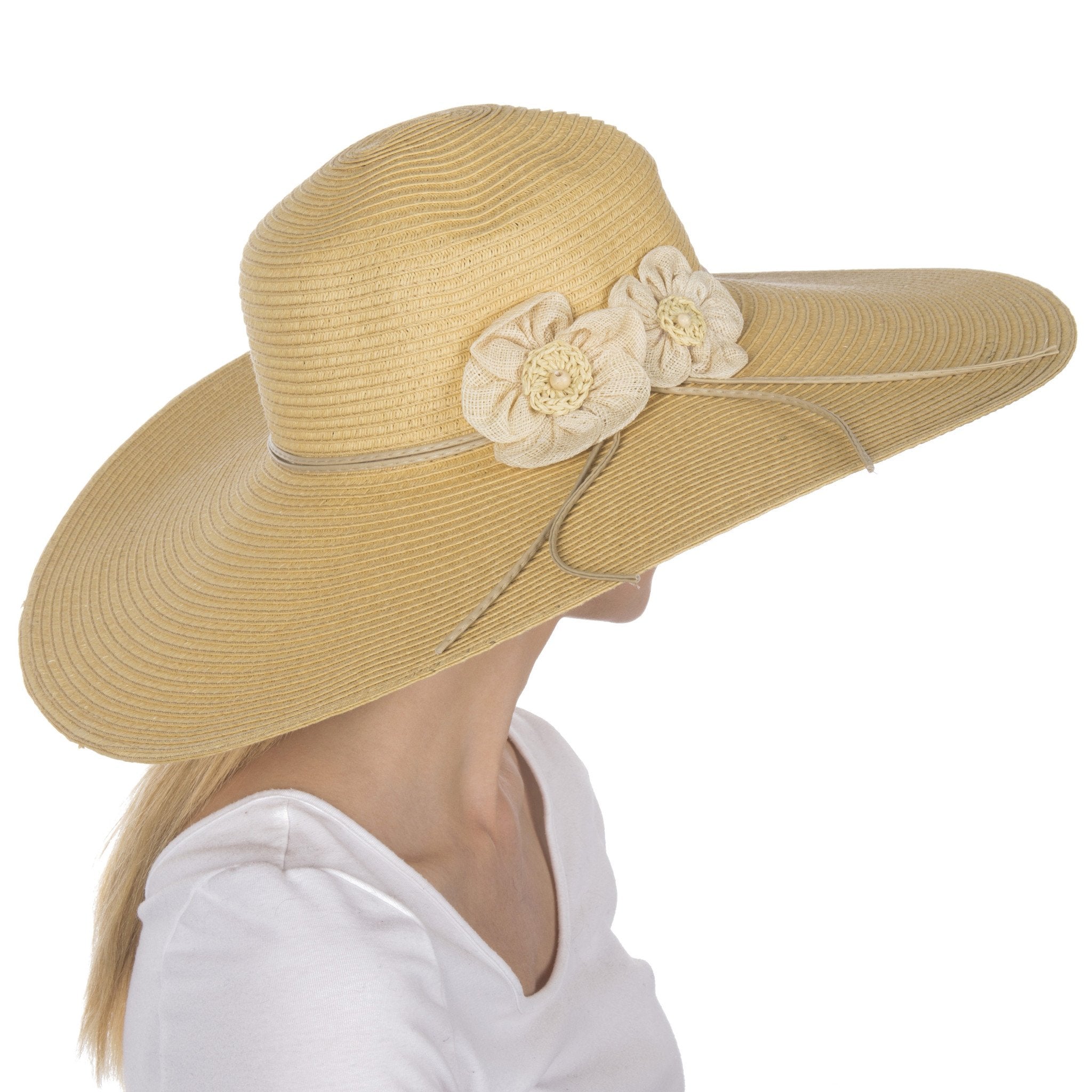Beige sun hat with floral embellishments on a white background