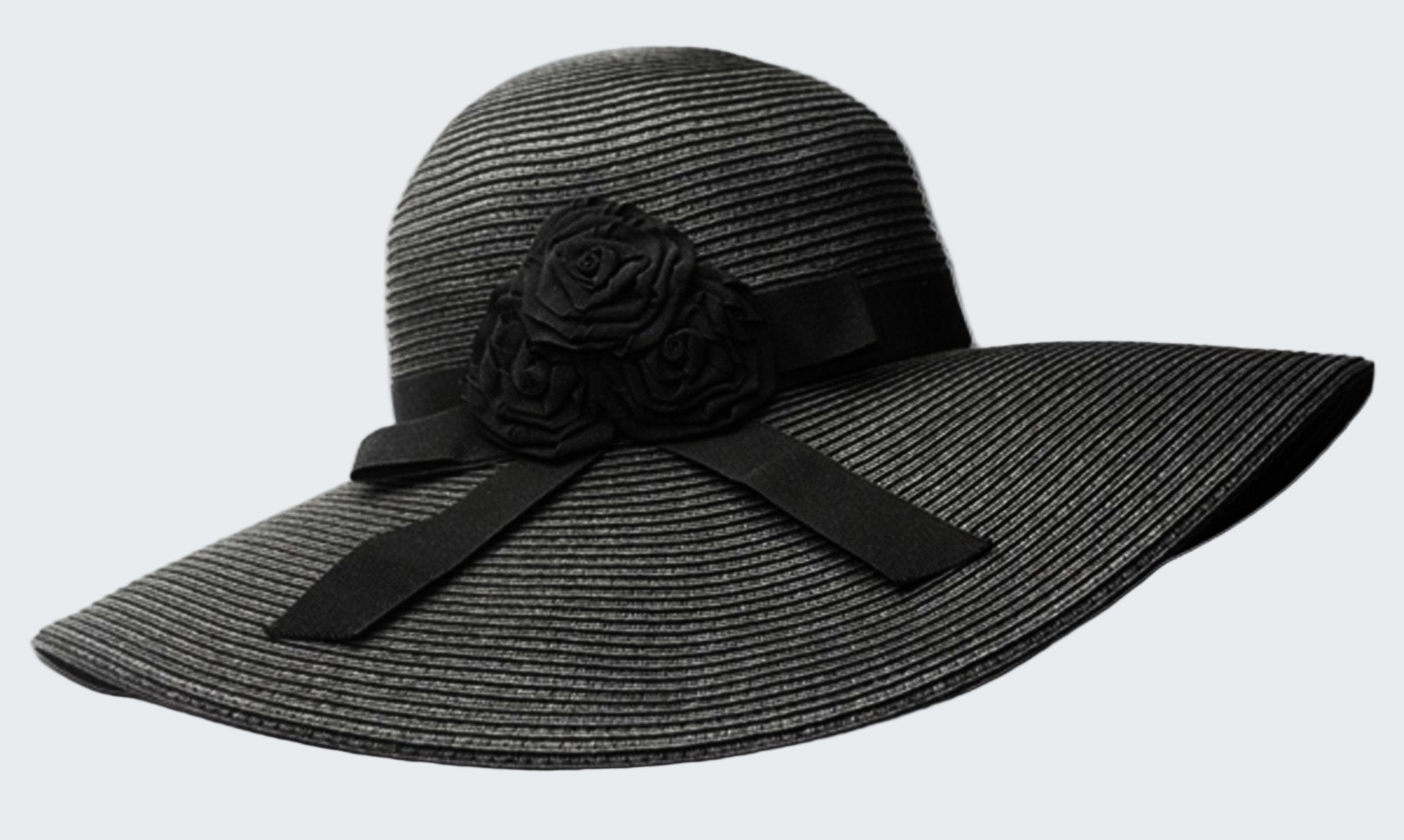 Black straw hat with a flower and bow on a white background