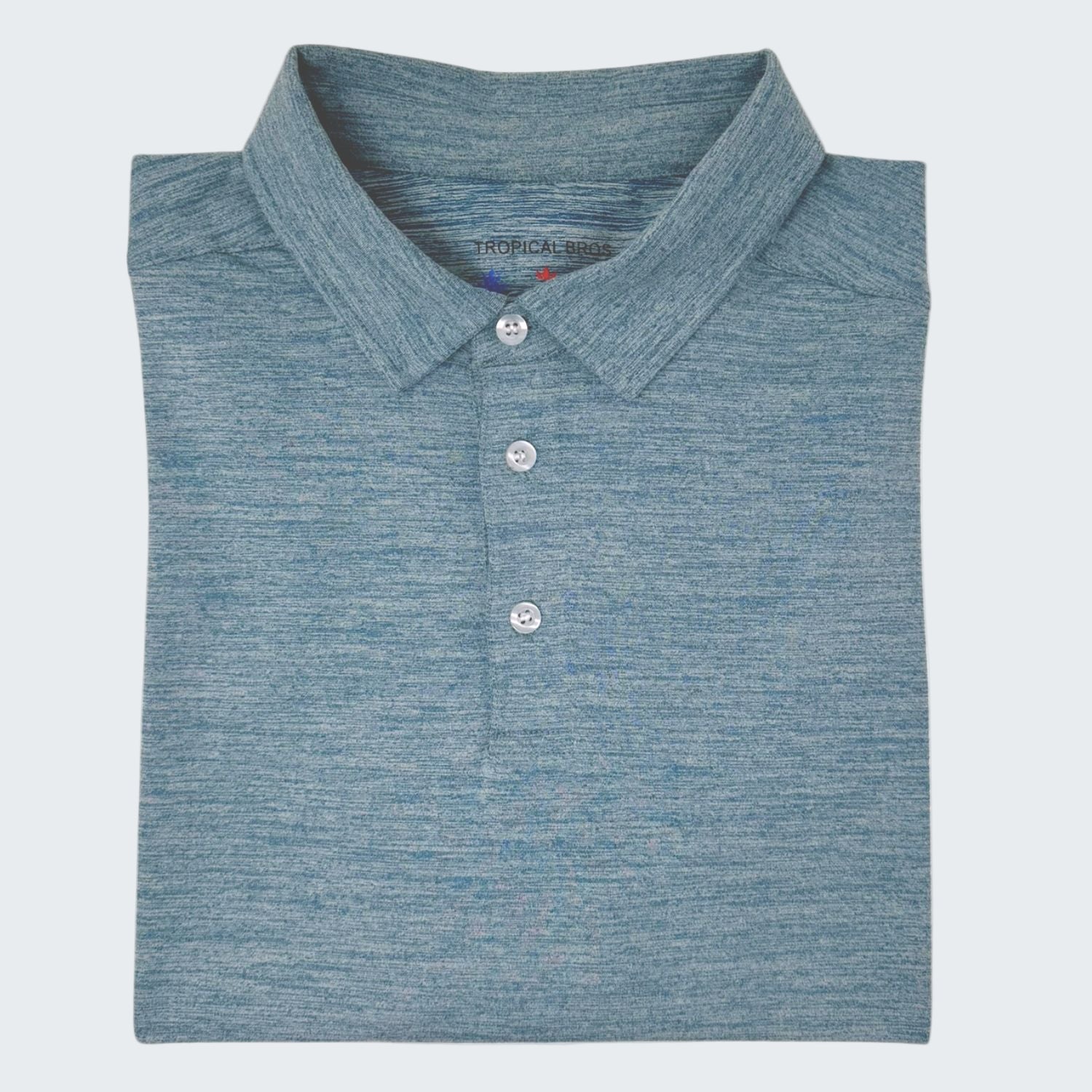 Folded blue polo shirt with a brand label on a white background