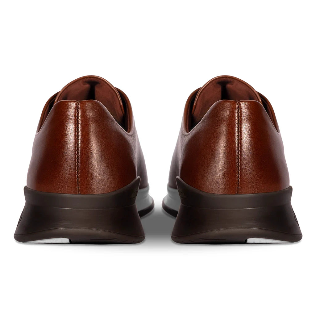 Brown leather shoes on a white background