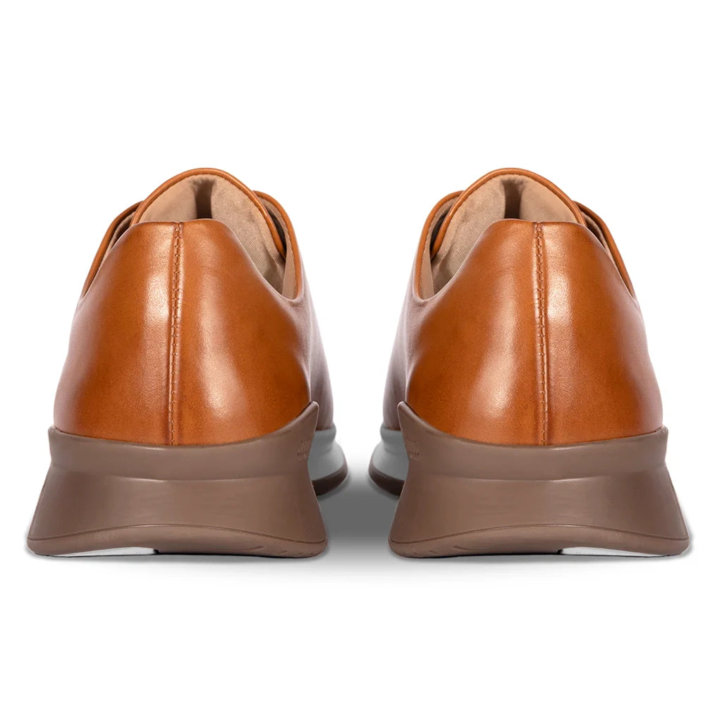 Pair of brown leather shoes on a white background