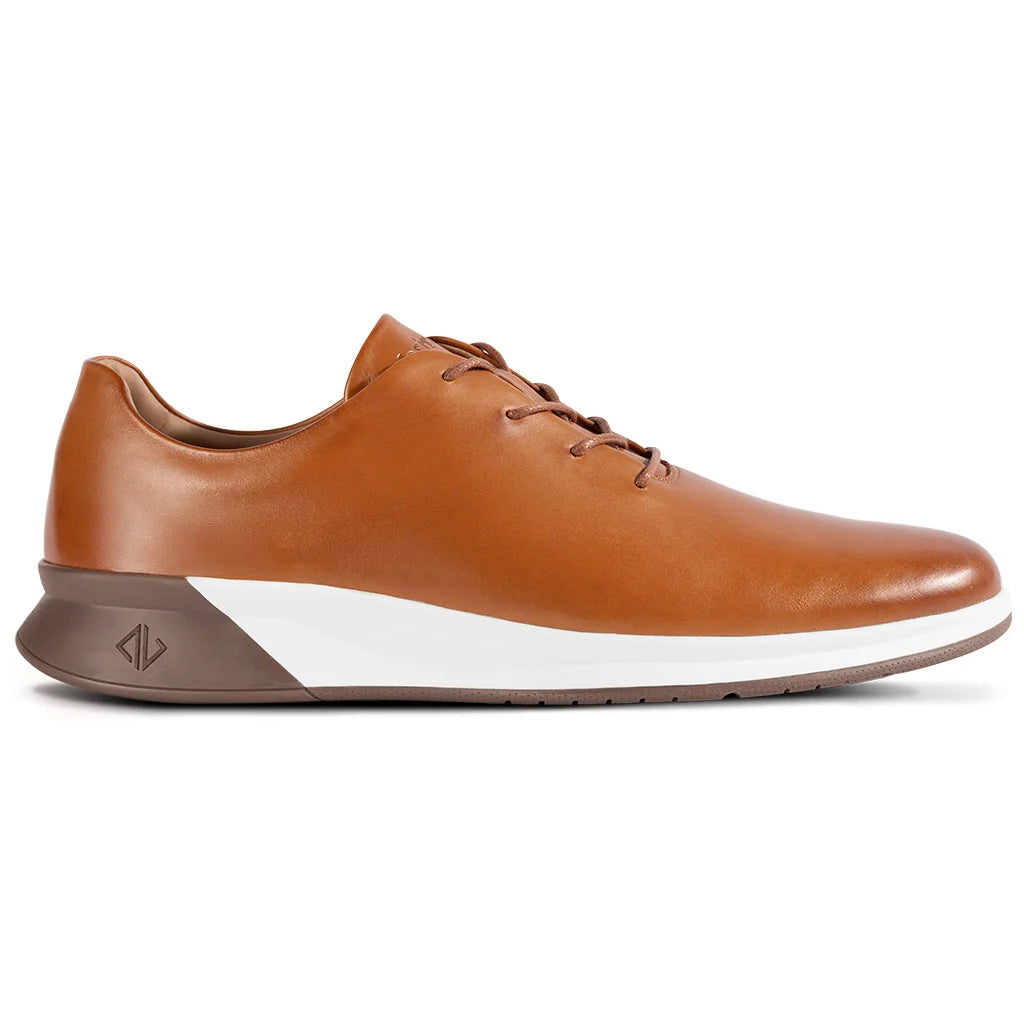 Brown leather shoe with a white sole on a white background