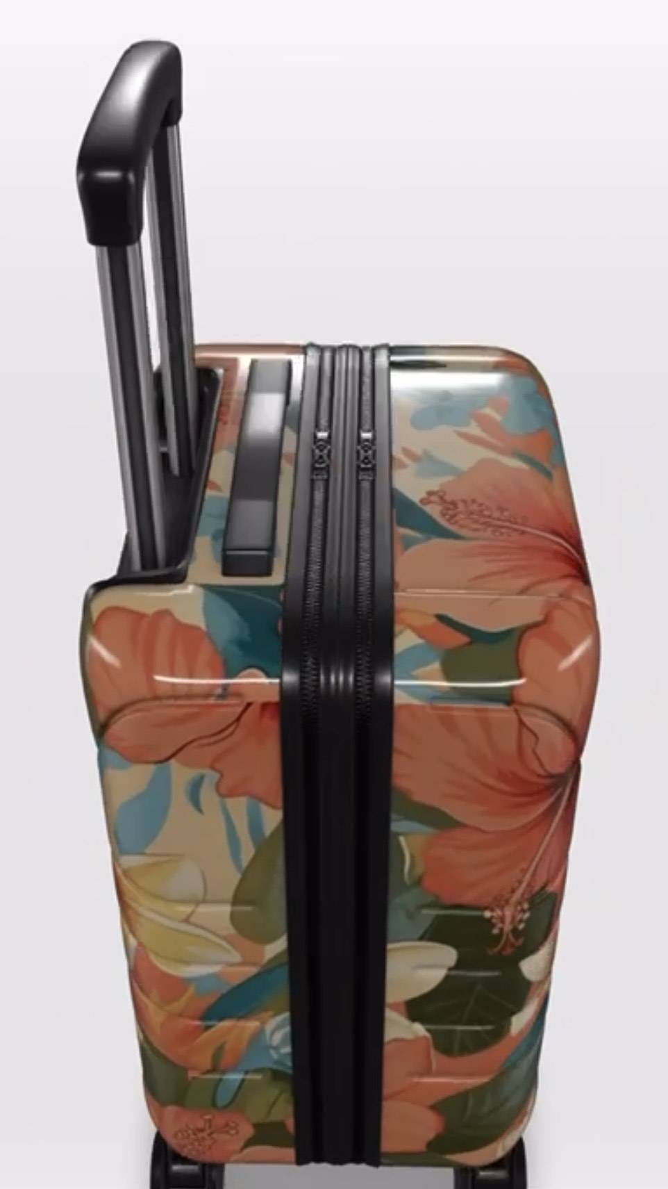 Floral-patterned suitcase on a white background