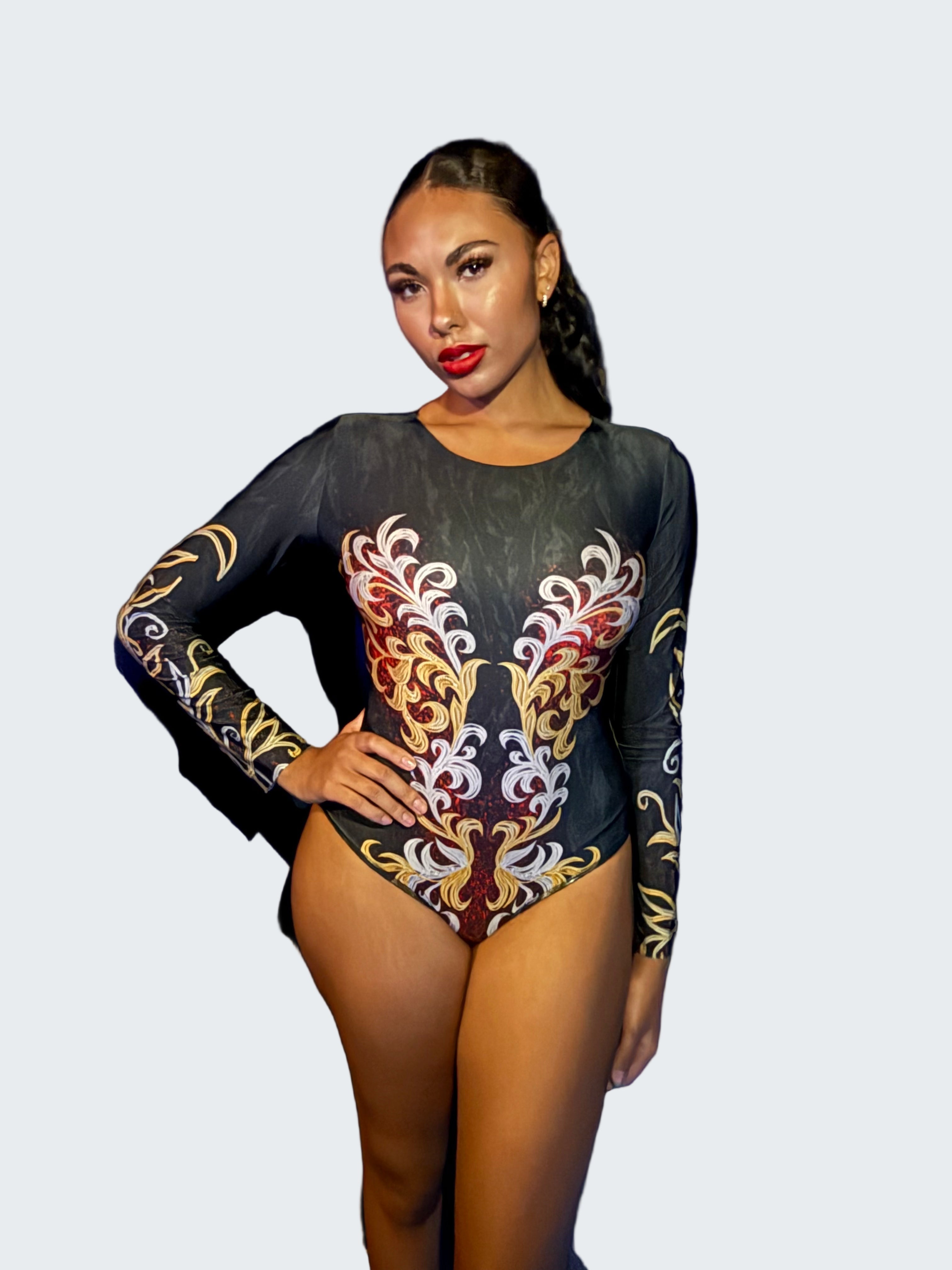 Person wearing a black leotard with colorful floral patterns against a blue curtain.