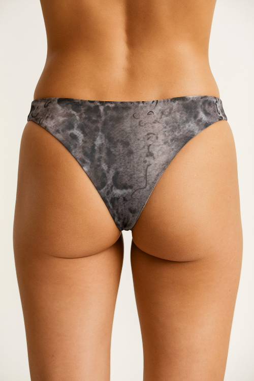 Gray patterned underwear worn by a person on a white background