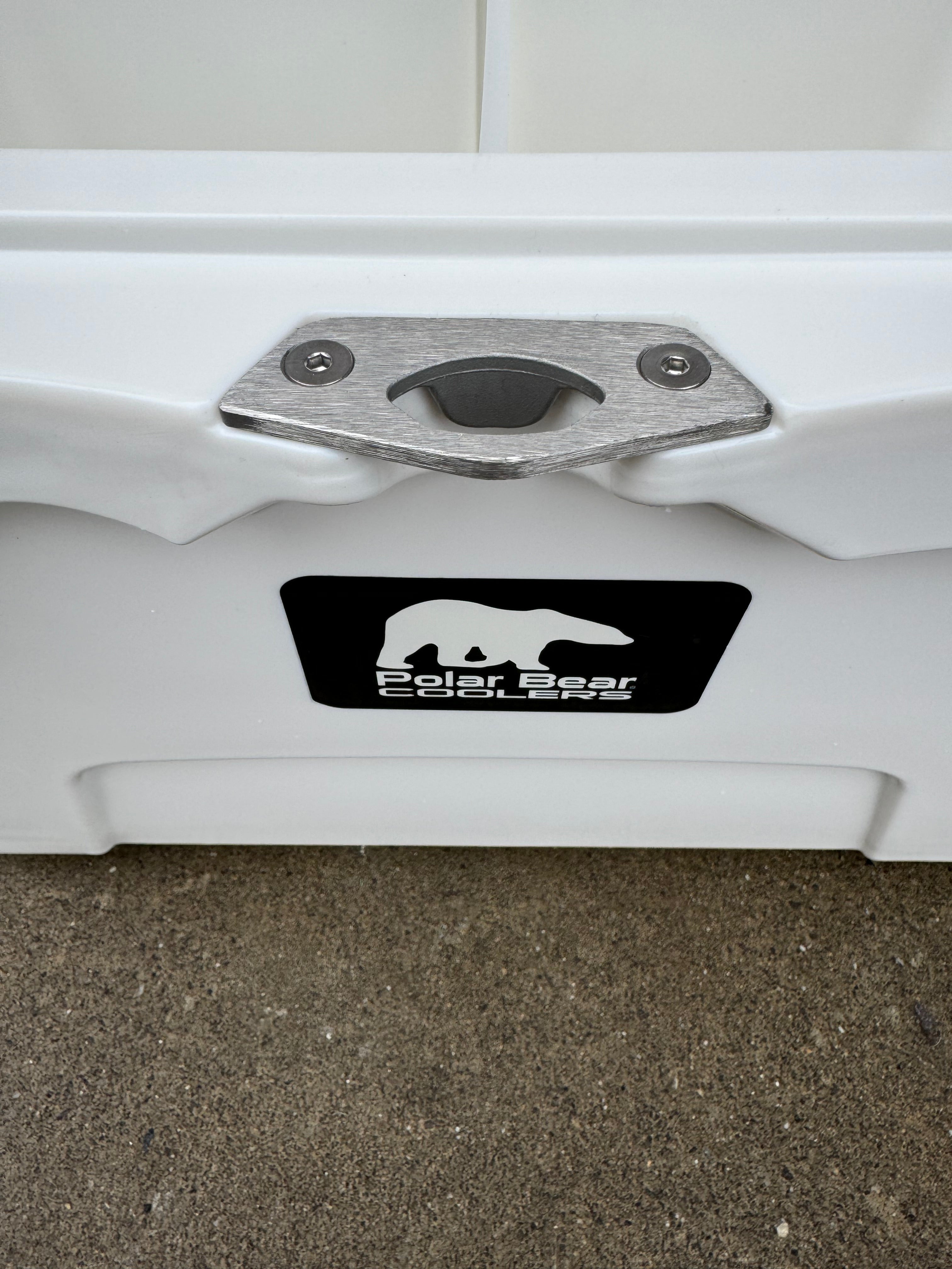 Close-up of a white vehicle with a metal bumper cover and Polar Bear logo.