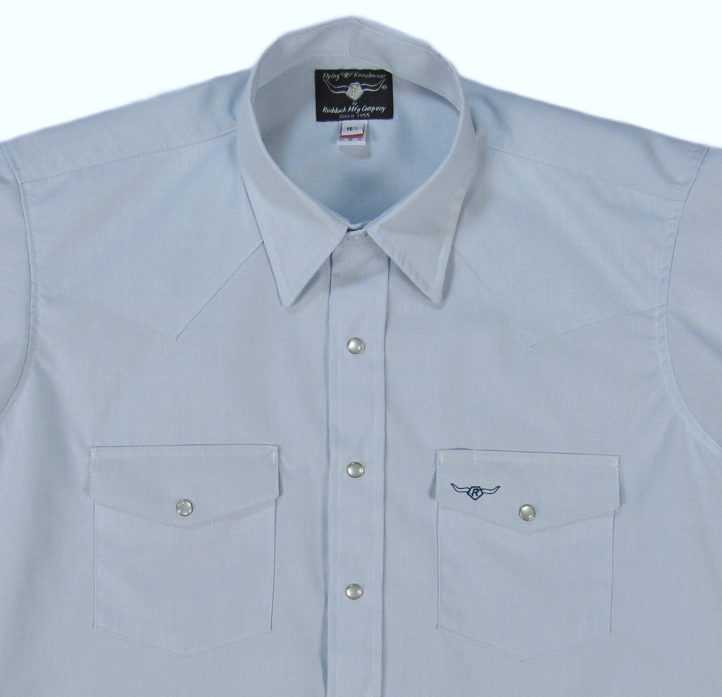 Light blue shirt with button details on a white background