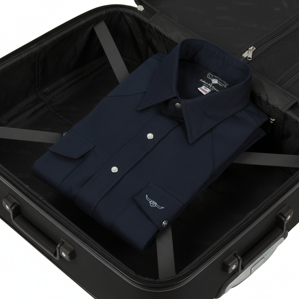 Folded black shirt with buttons on a white background