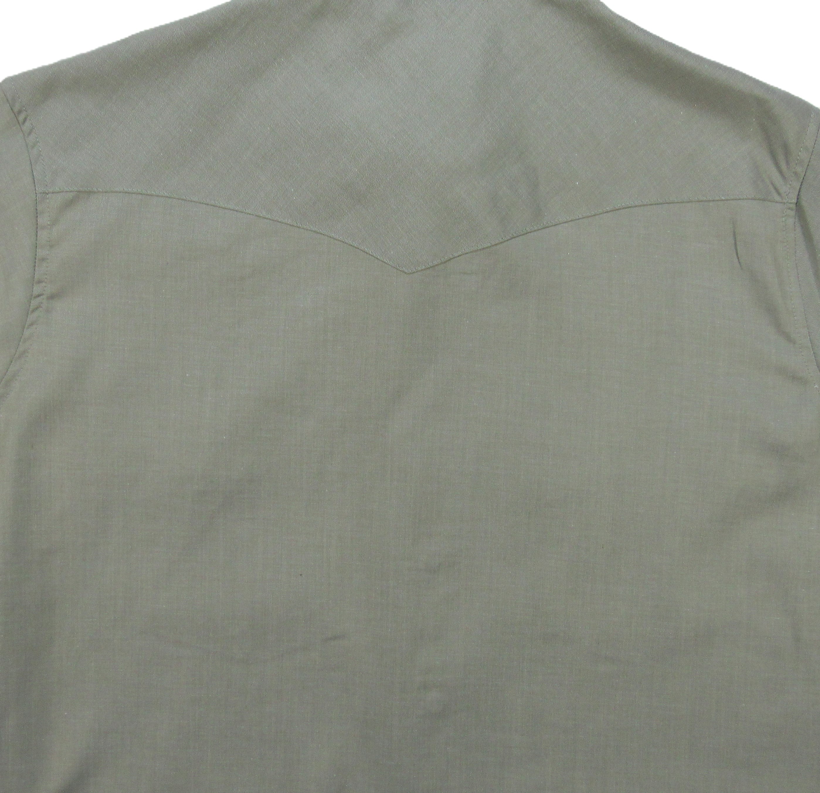 Green sleeveless shirt on a white background
