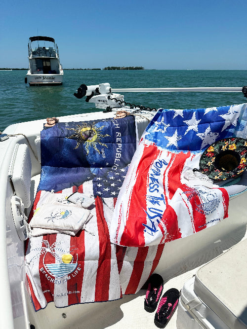 Boat with various flags and items on a sunny day at sea