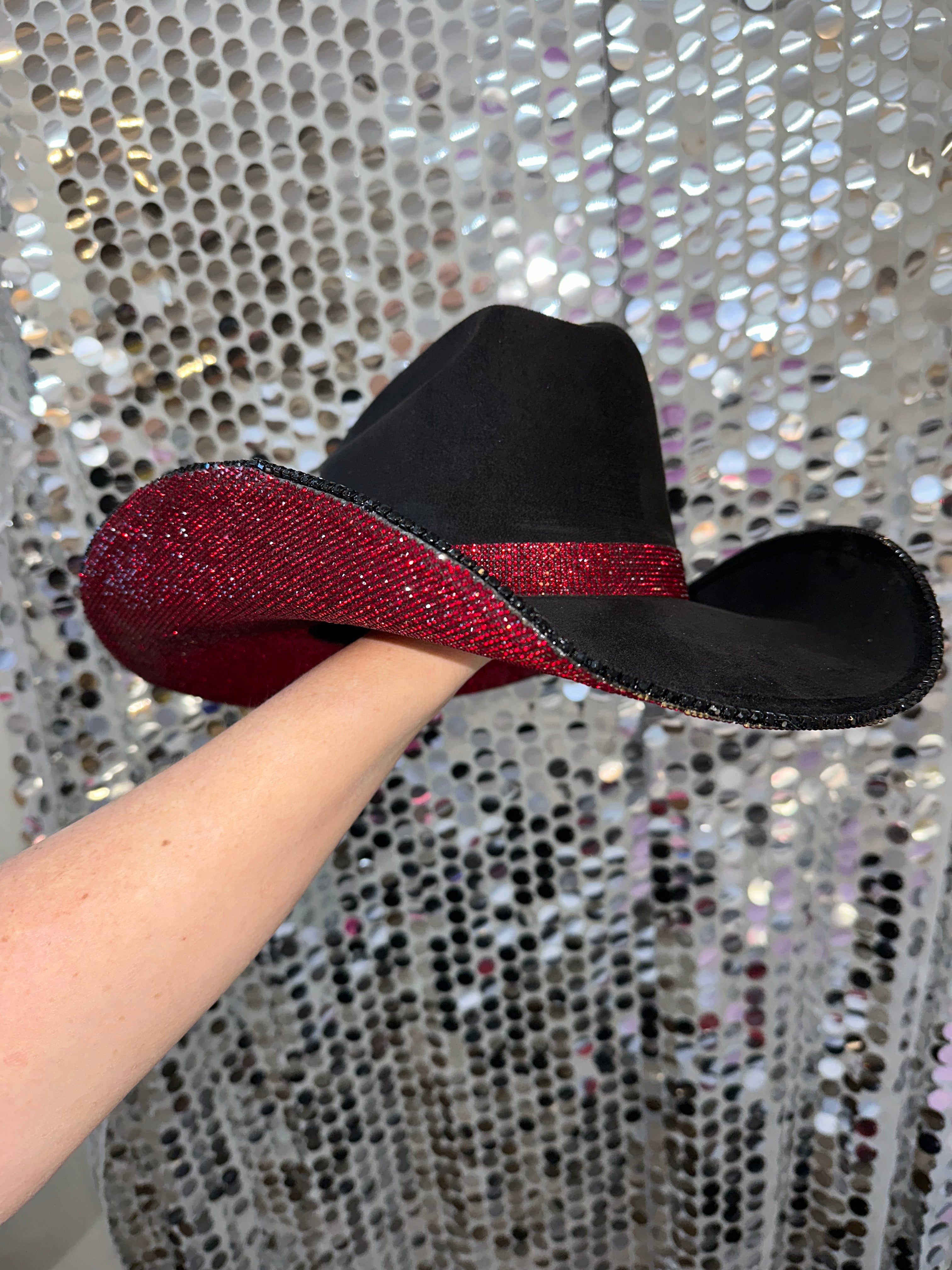 Black and red glittery shoe with a sequin background