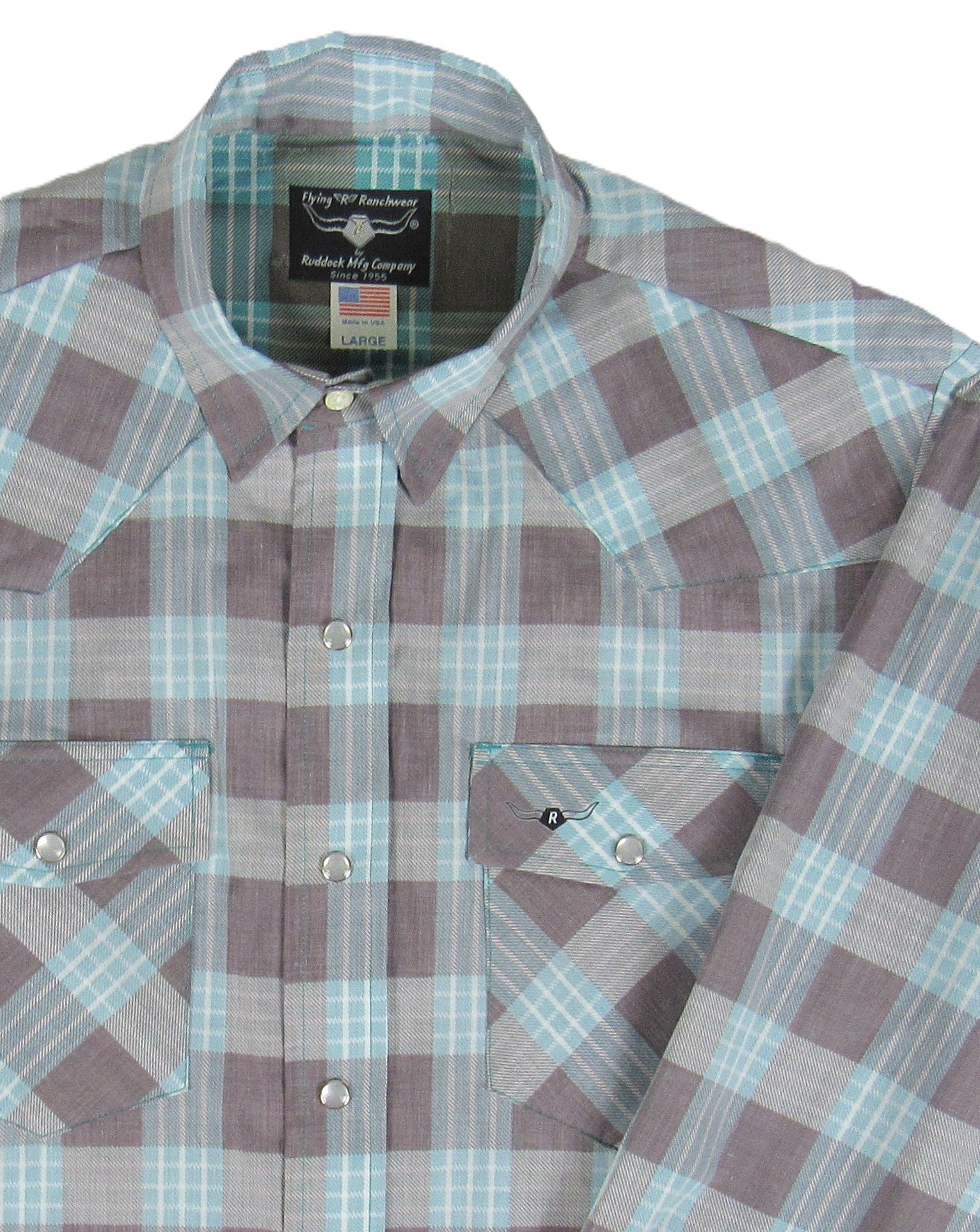 Plaid shirt with visible brand label on a white background