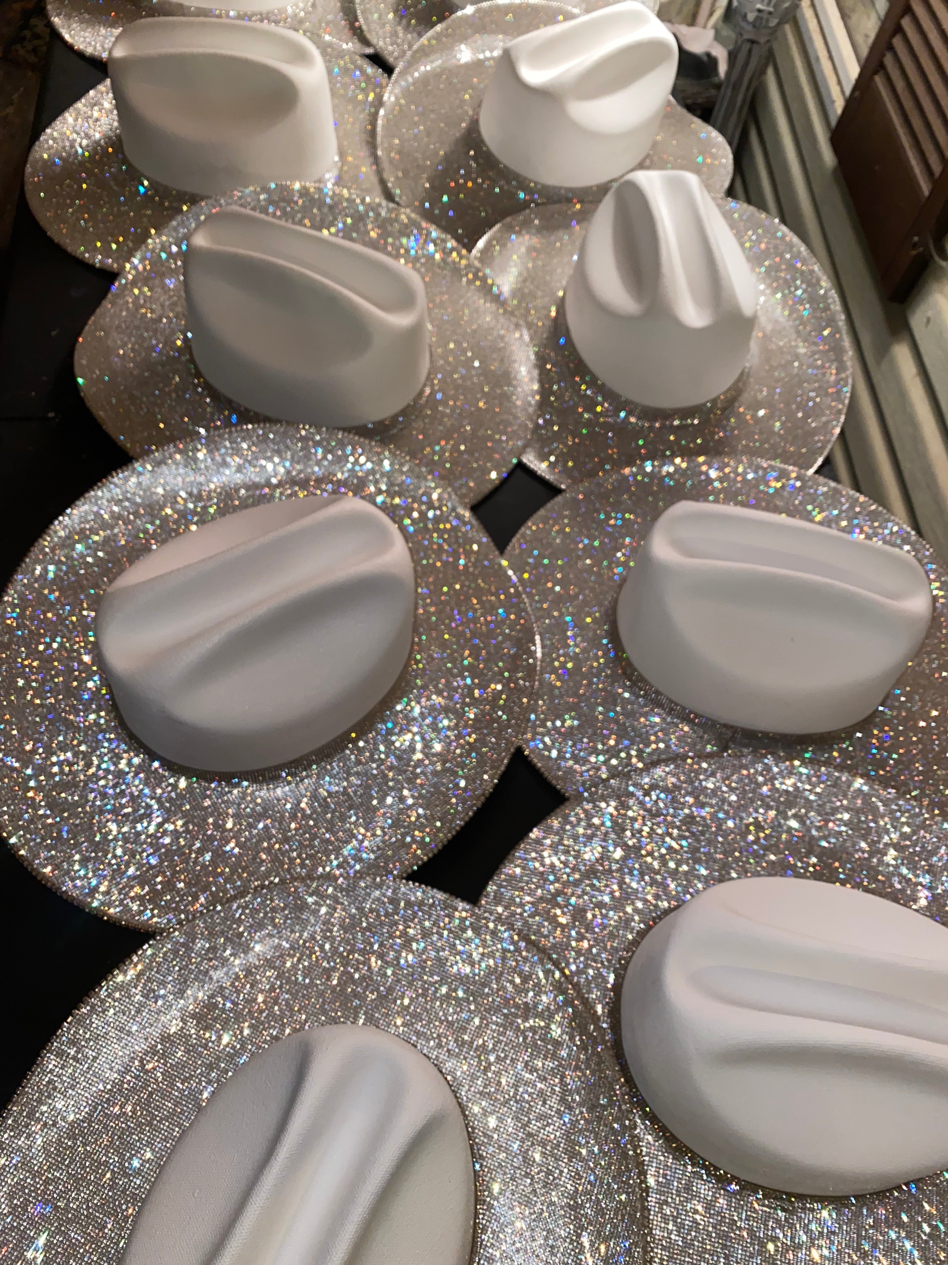 White knobs on a glittery surface
