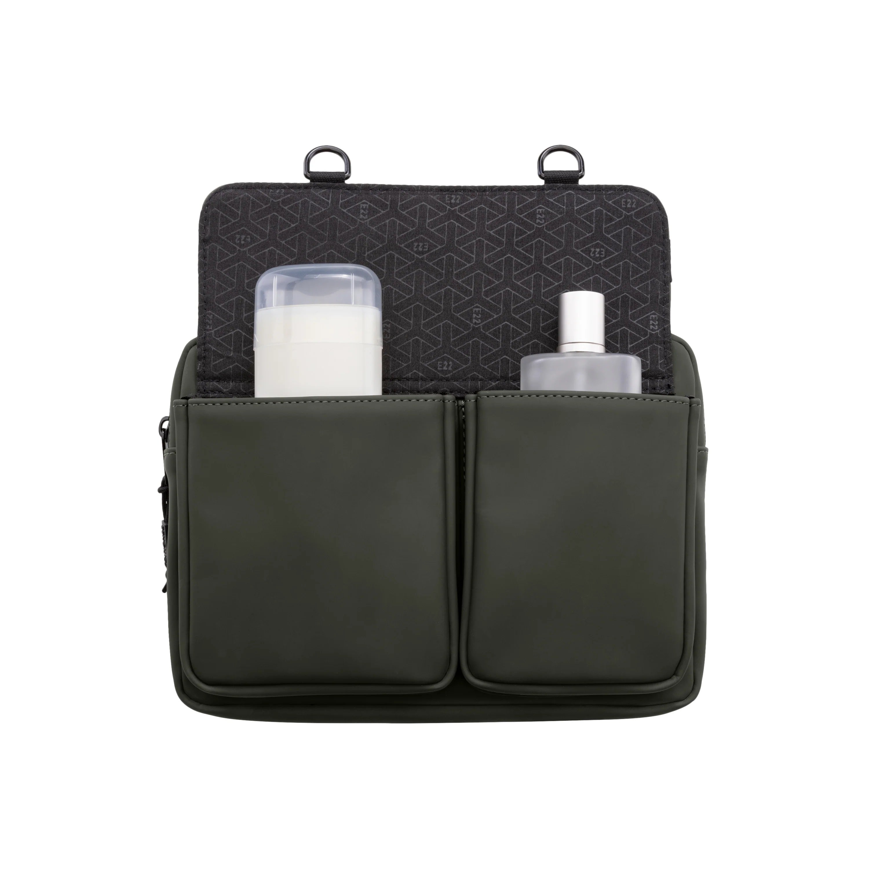 Black travel organizer with compartments containing a bottle and a container on a white background