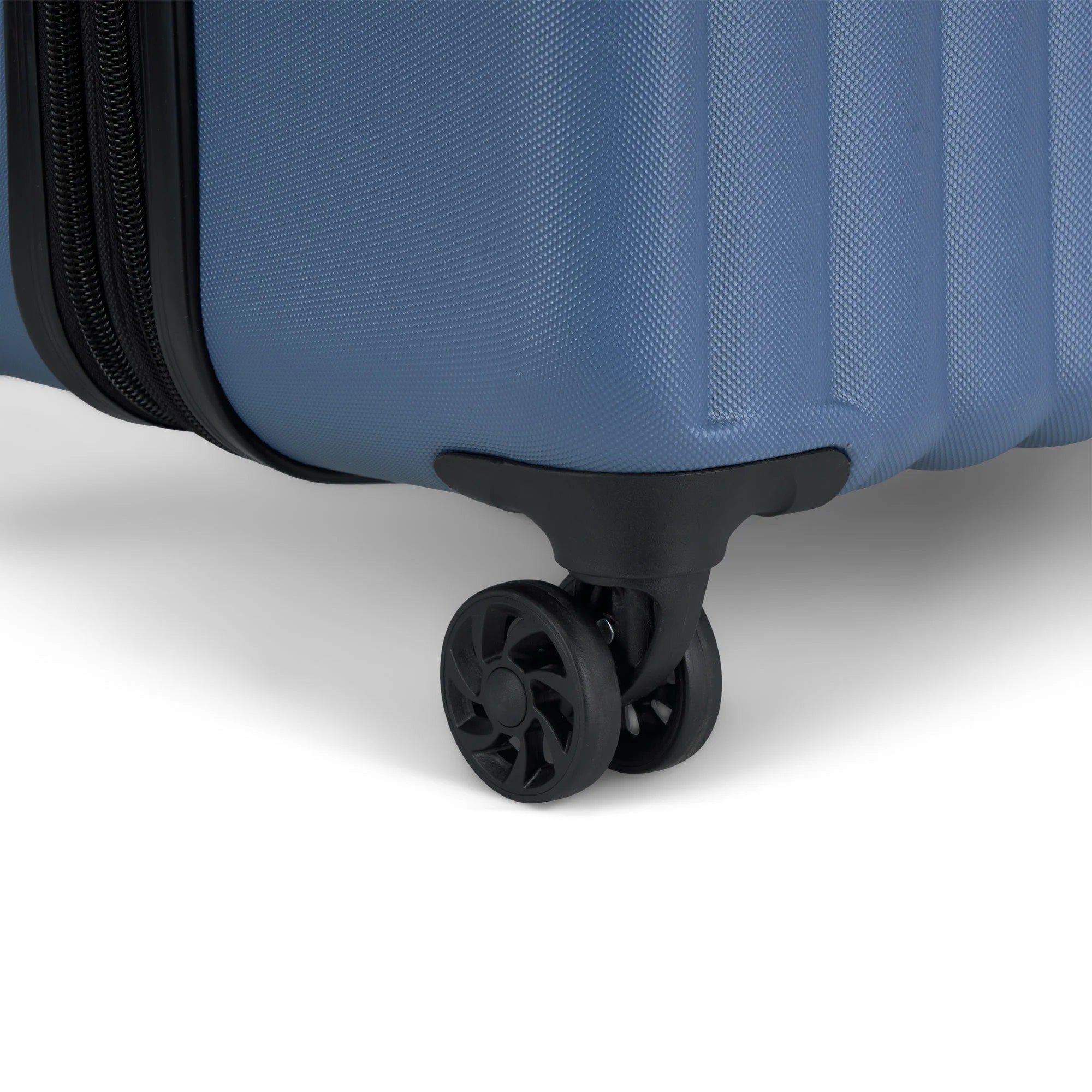 Close-up of a blue suitcase with wheels on a white background