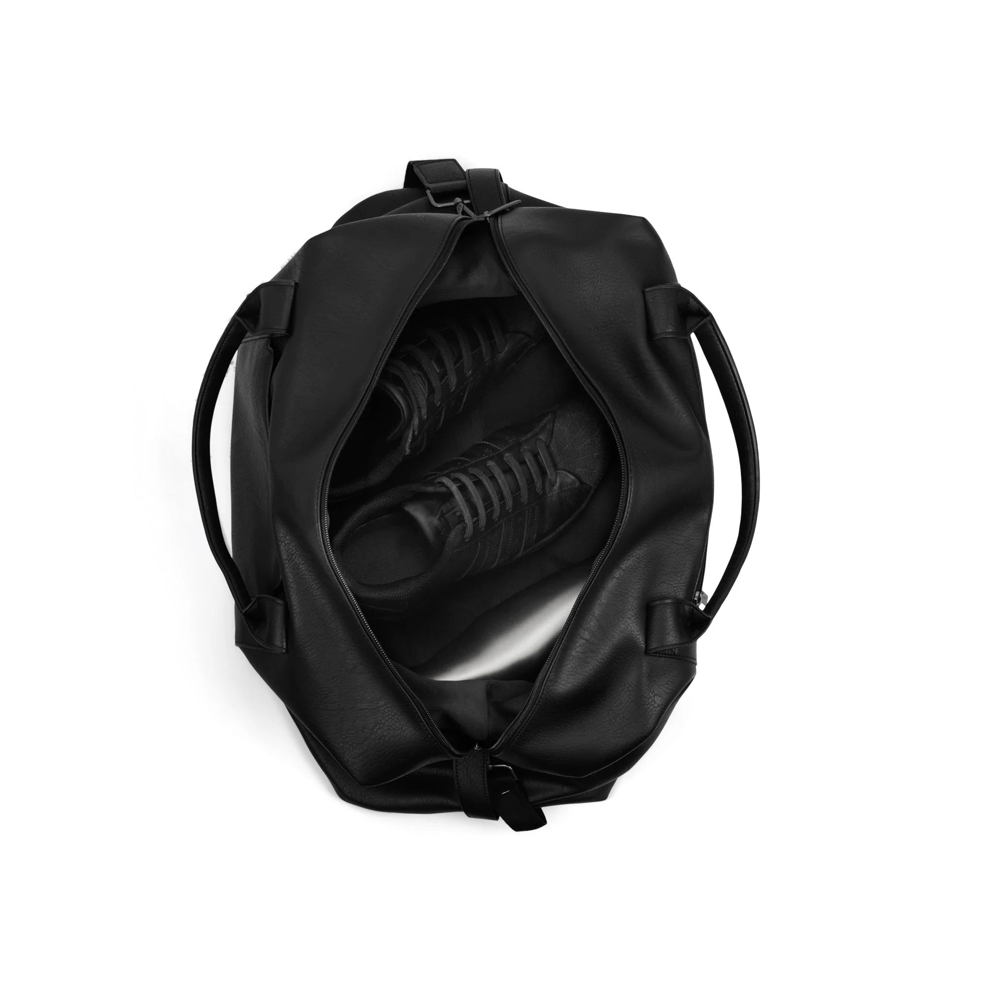 Black duffel bag with a shoe inside on a white background