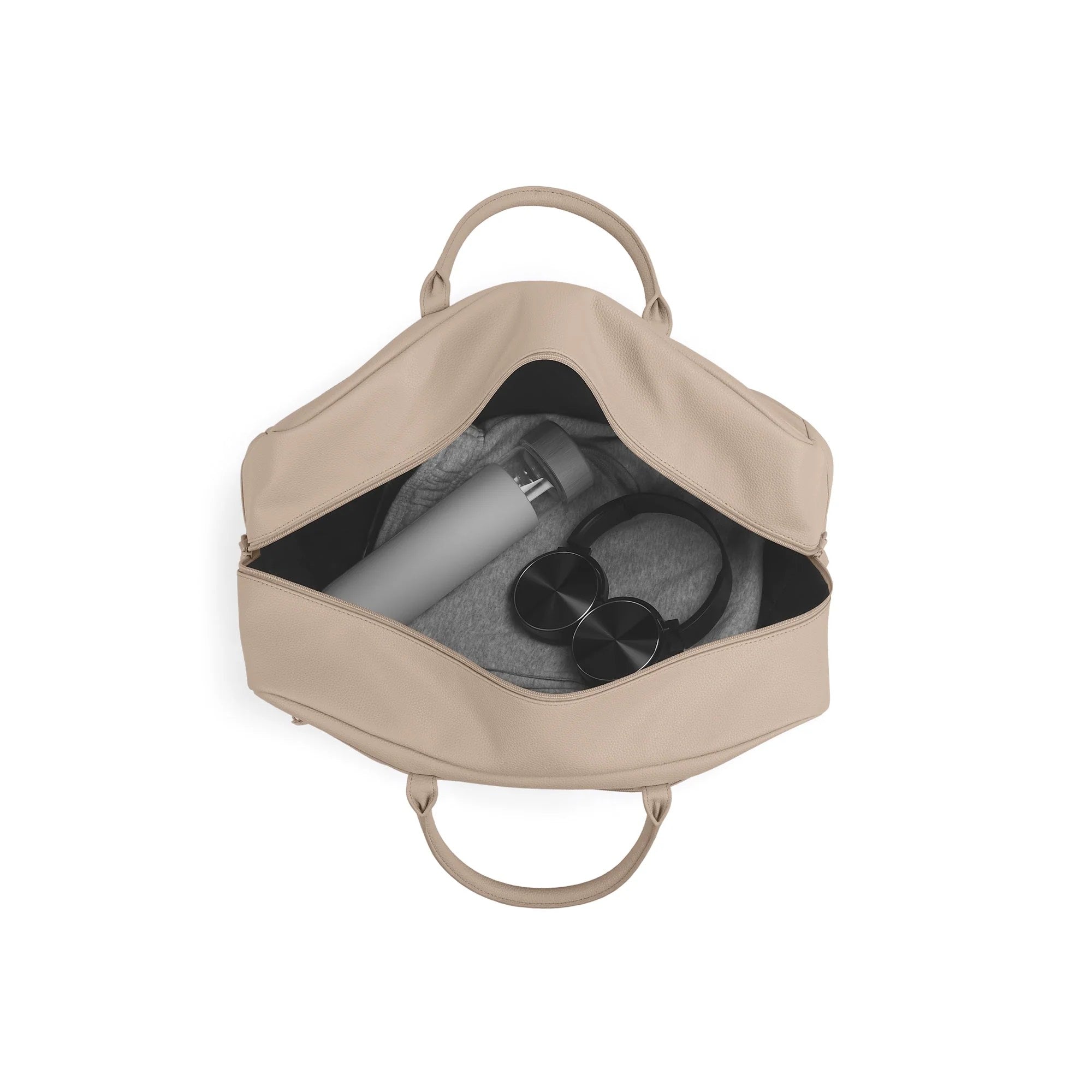 Beige backpack with a water bottle and headphones inside on a white background