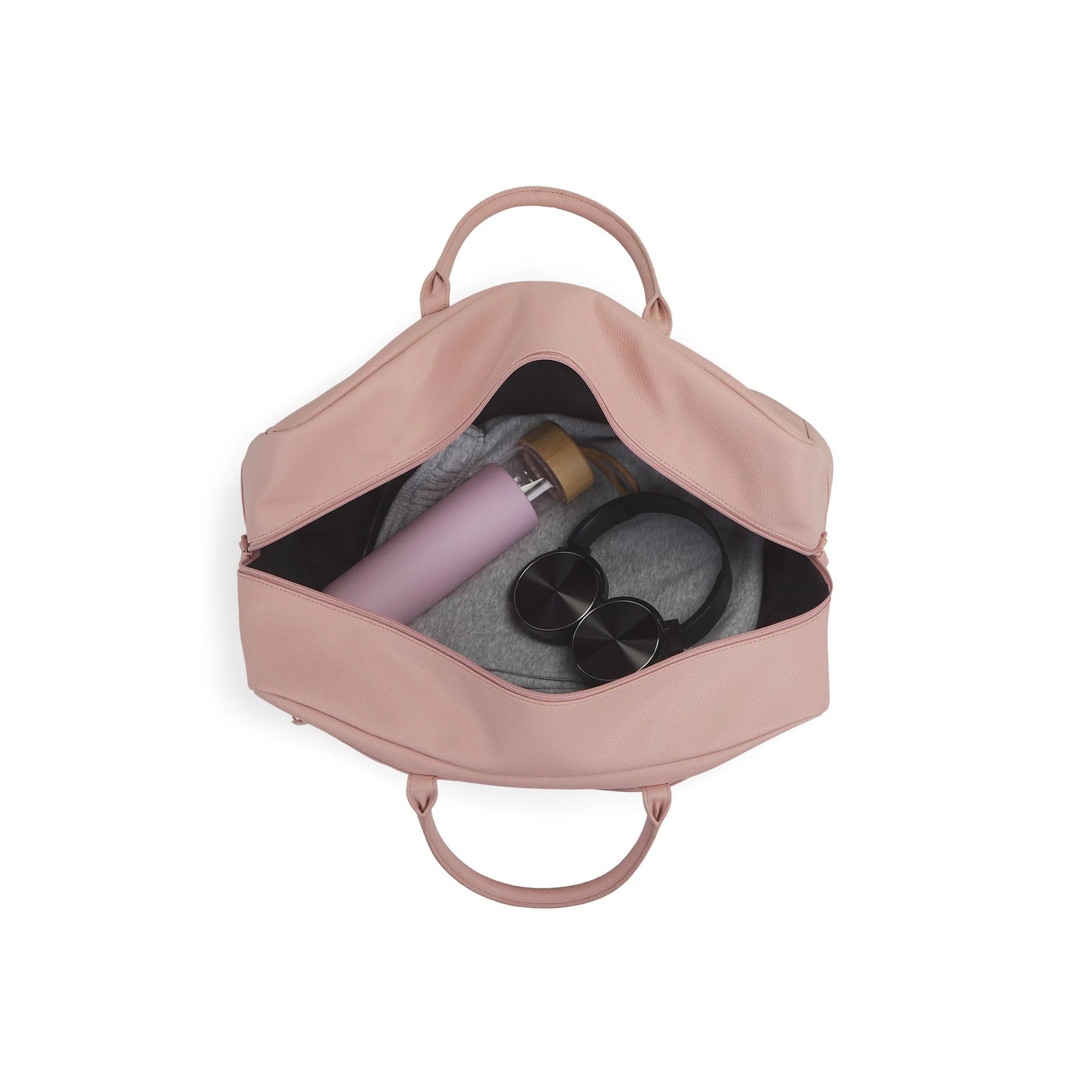 Pink backpack with a water bottle and sunglasses on a white background