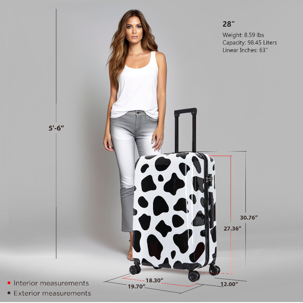 Woman standing next to a cow print suitcase with measurements displayed