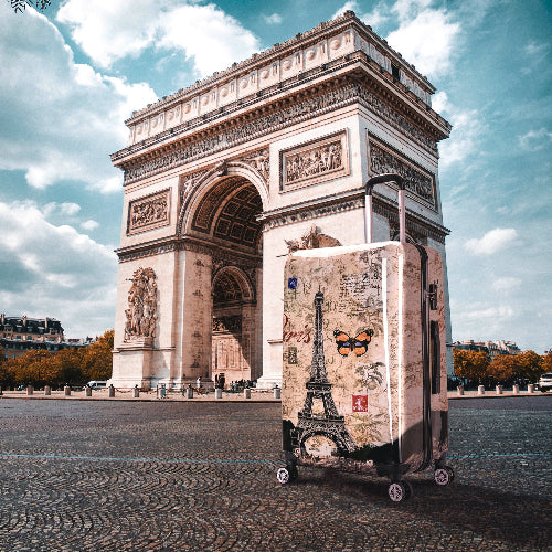 Suitcase with Eiffel Tower design in front of the Arc de Triomphe, Paris