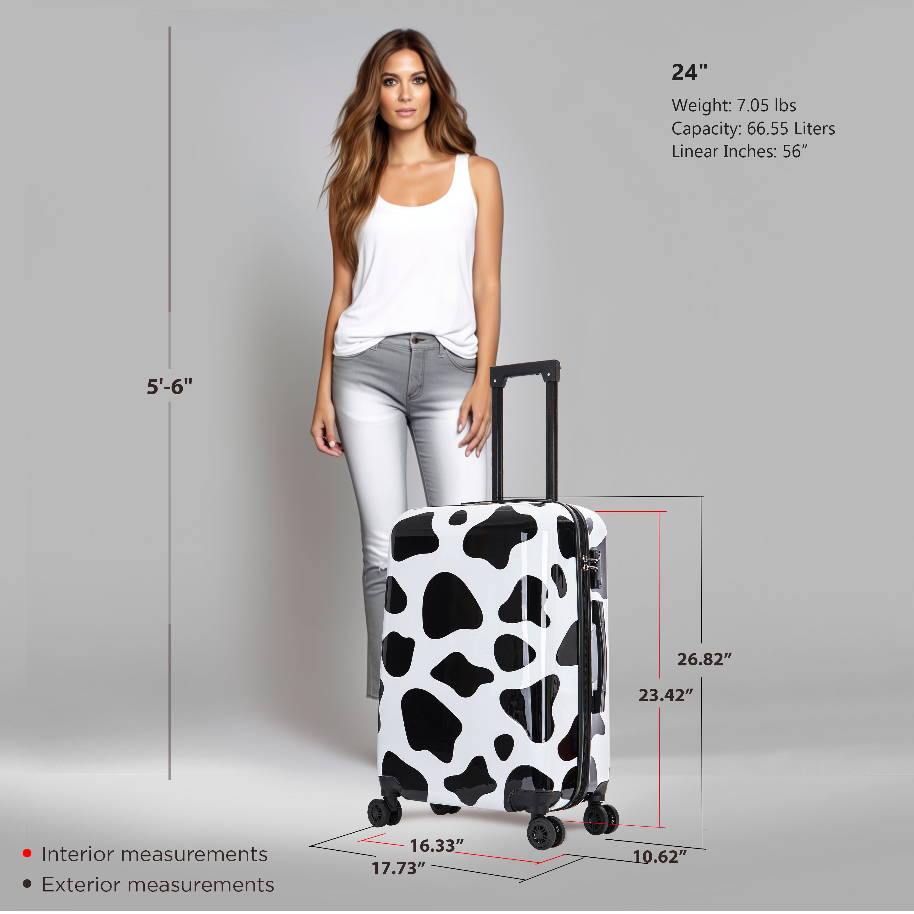 Woman standing next to a cow print suitcase with measurements displayed