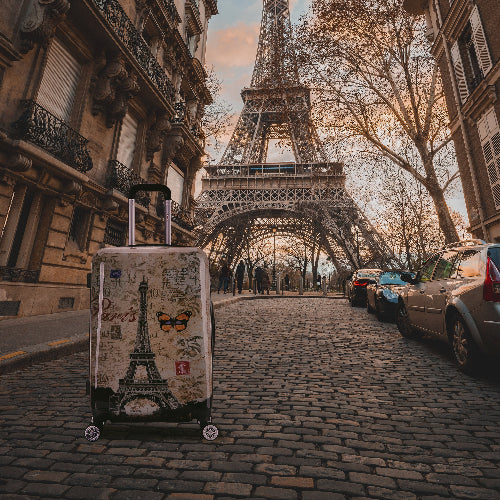 Luggage with Eiffel Tower design on a street in Paris, France