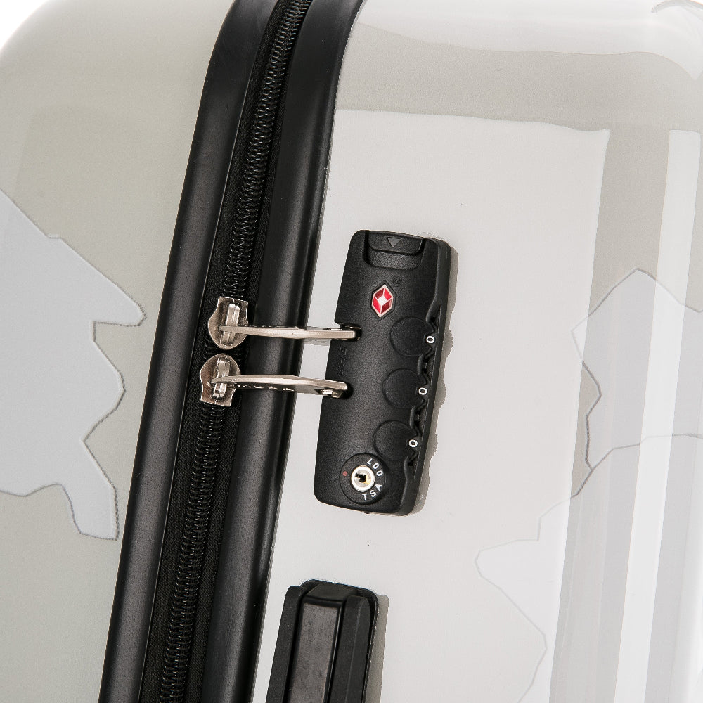 Close-up of a suitcase with a black lock on a light gray background