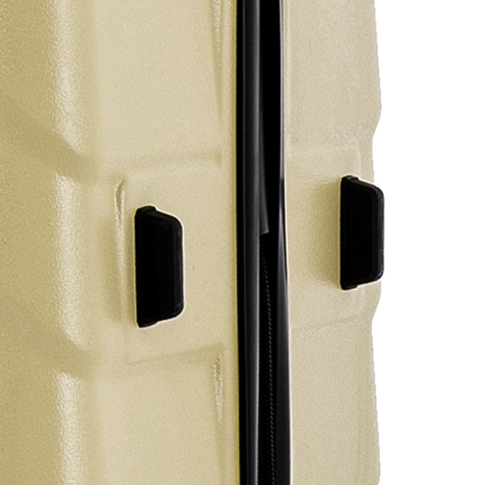 Close-up of a beige suitcase with black handles and zipper