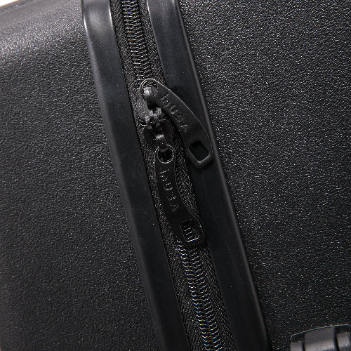 Close-up of a black suitcase zipper with brand logo