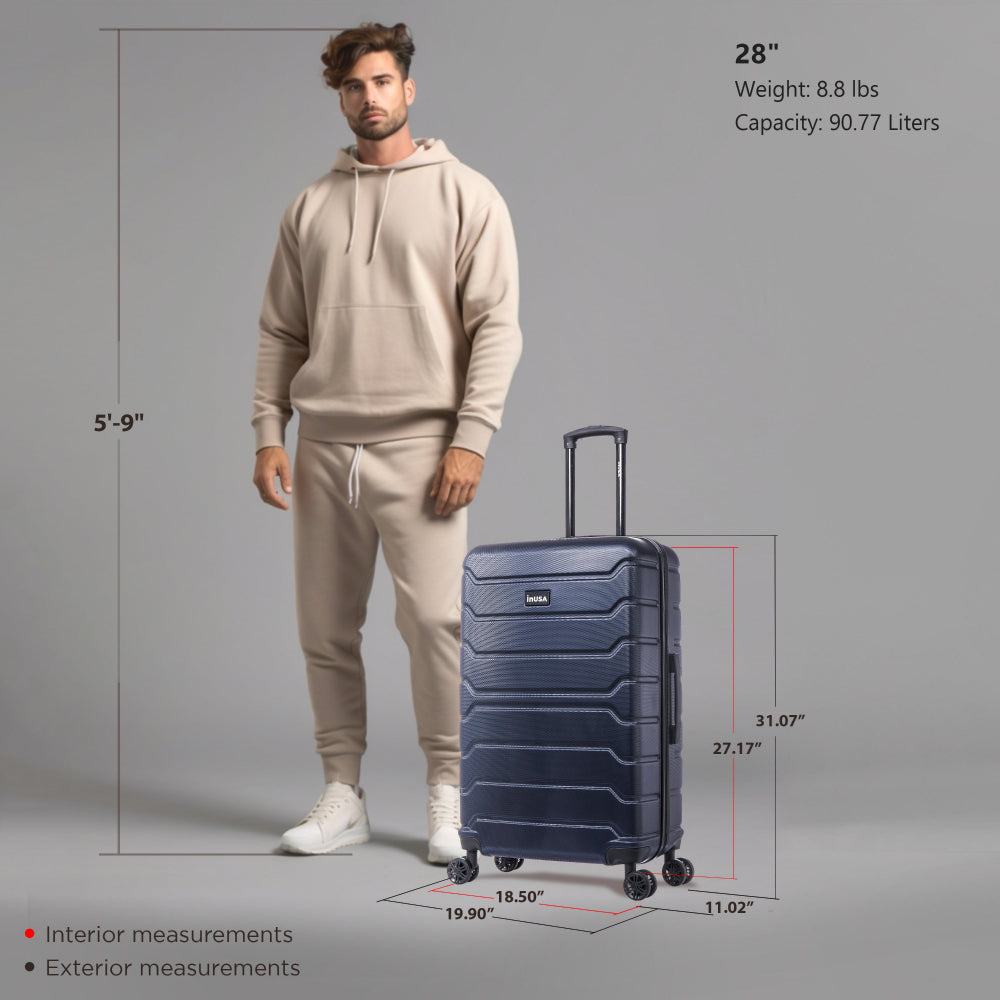 Man standing next to a navy suitcase with measurements and specifications on a gray background