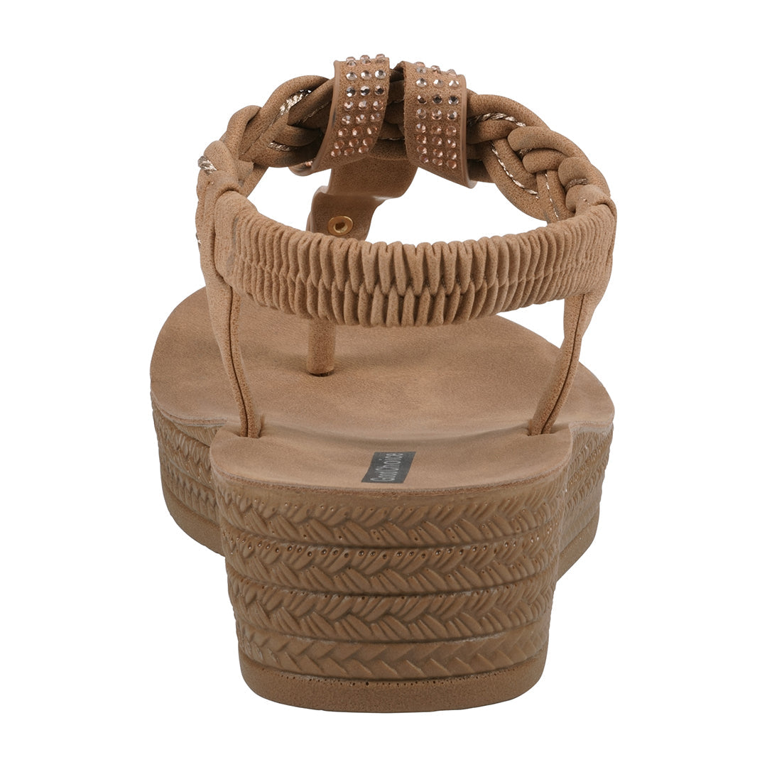 Tan sandal with braided design on a white background
