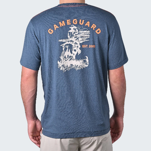 Blue t-shirt with 'Gameguard' logo on the back, worn by a person