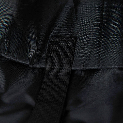 Close-up of a black backpack strap with fabric texture