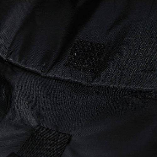 Close-up of a black jacket with a patch on the chest.