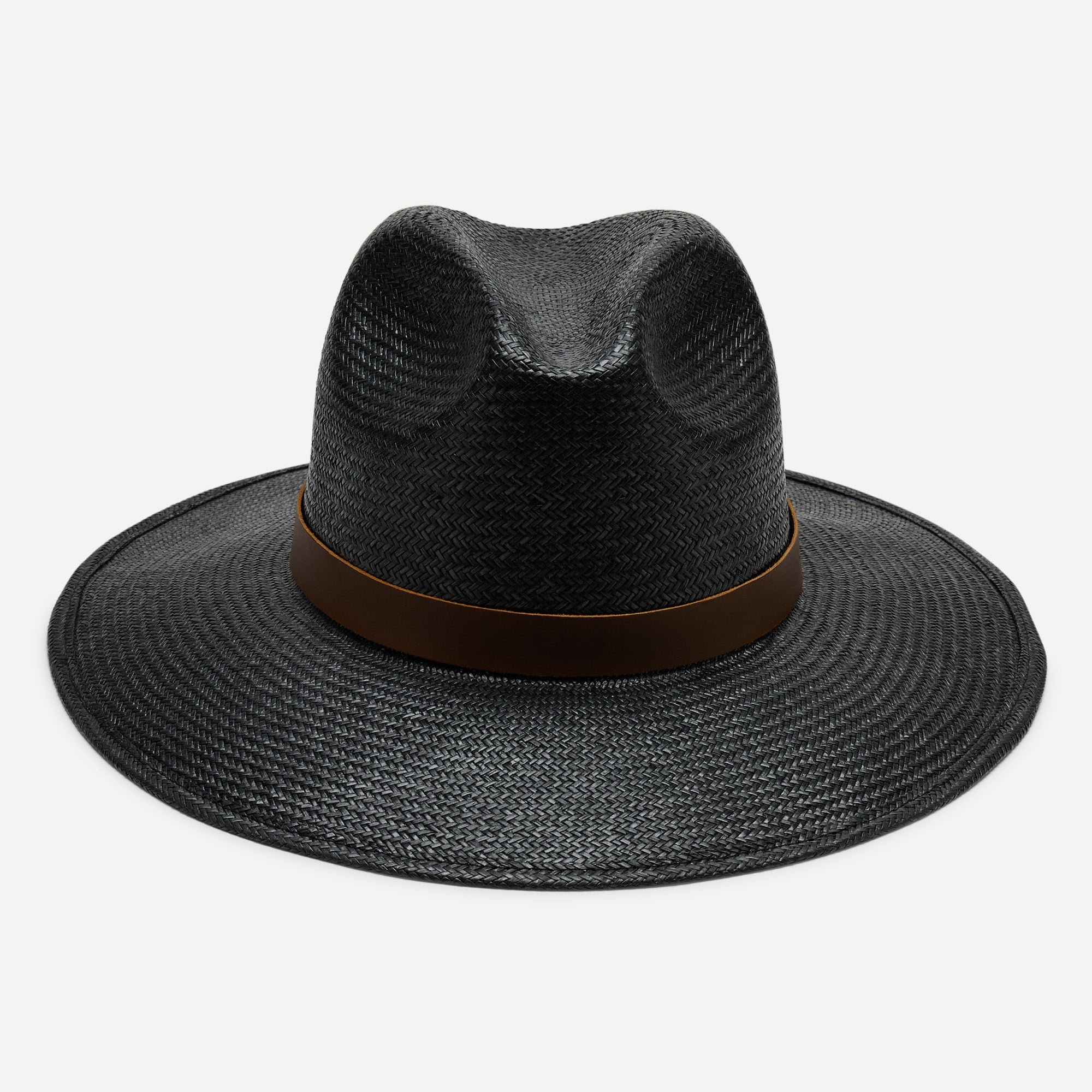 Black straw hat with a brown band on a white background