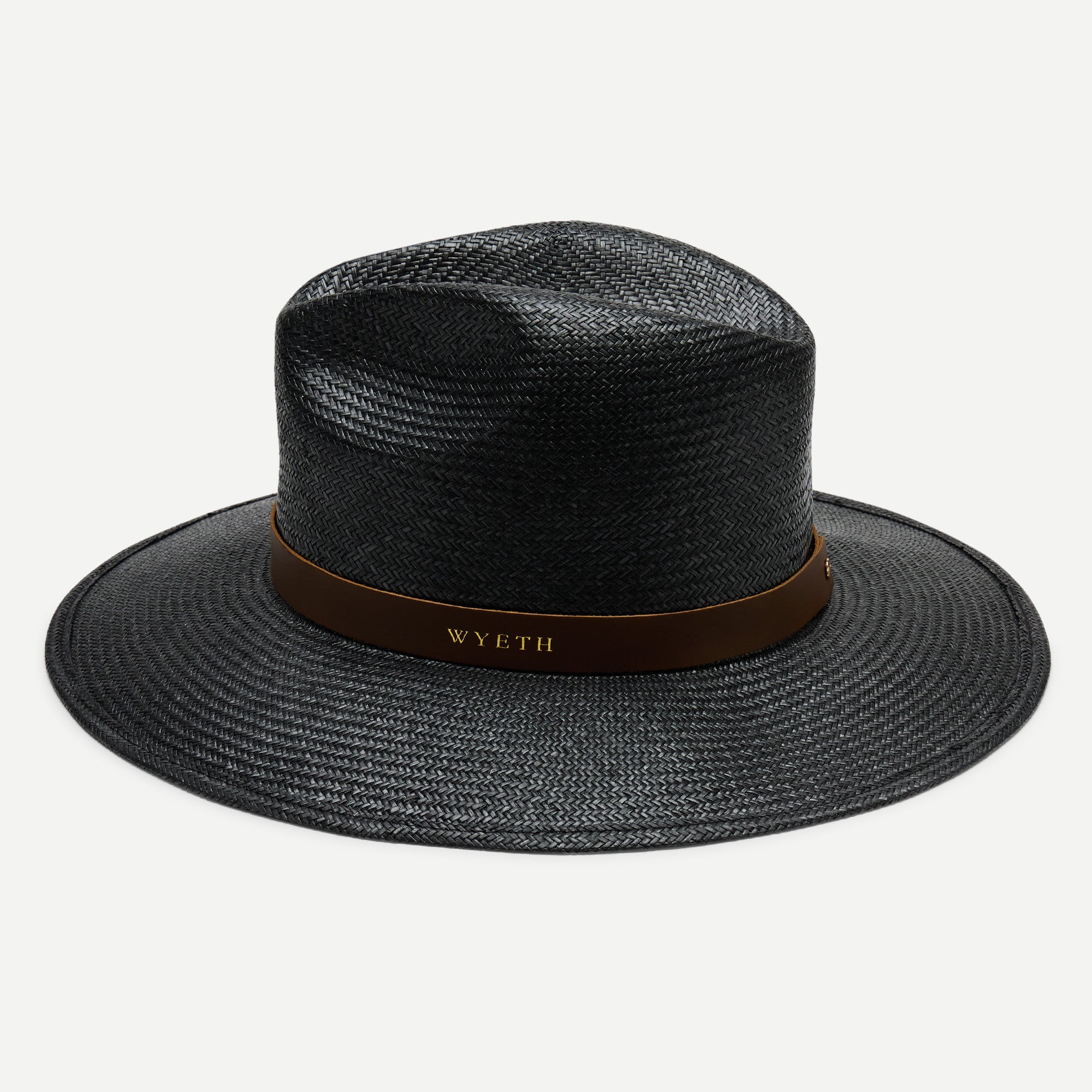 Black straw hat with a brown band on a white background