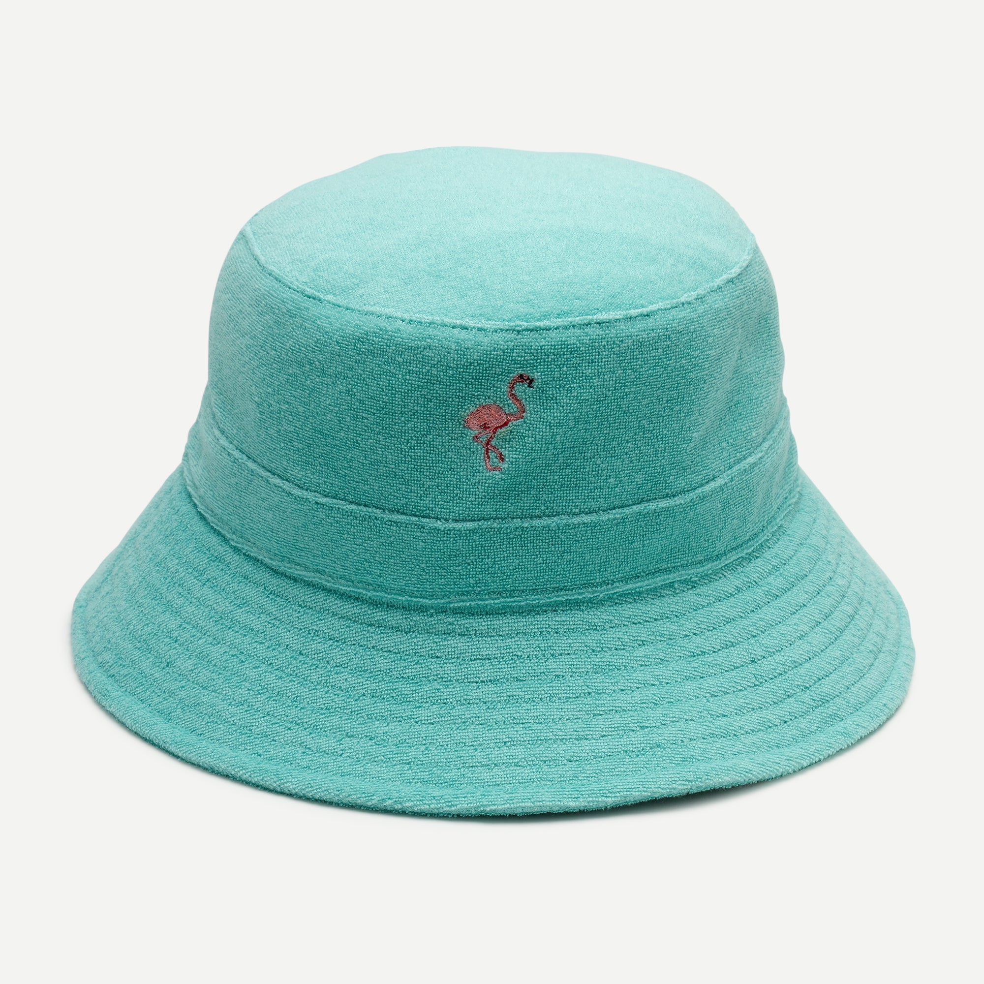 Teal bucket hat with a flamingo embroidery on a light gray background