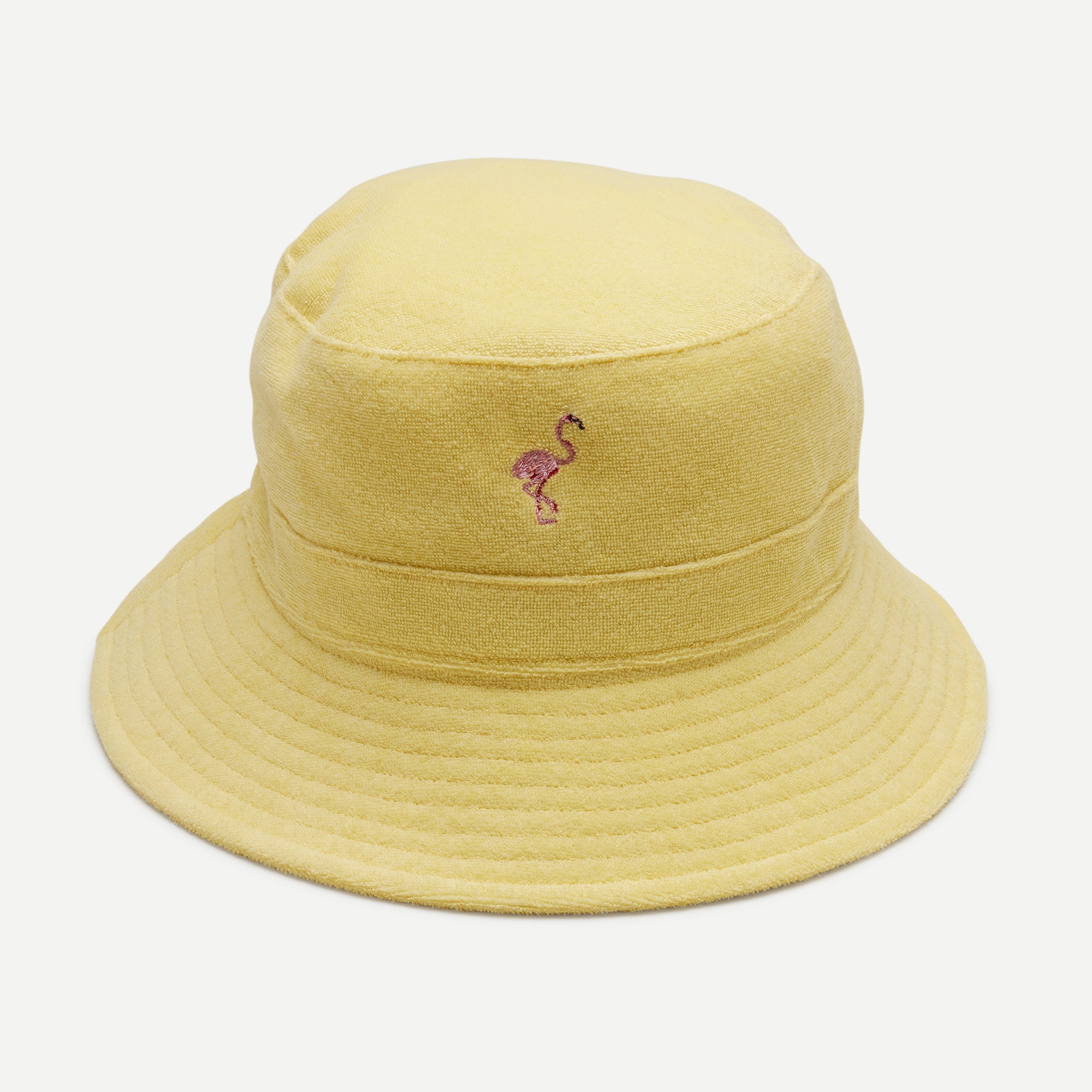 Yellow bucket hat with a flamingo emblem on a light gray background
